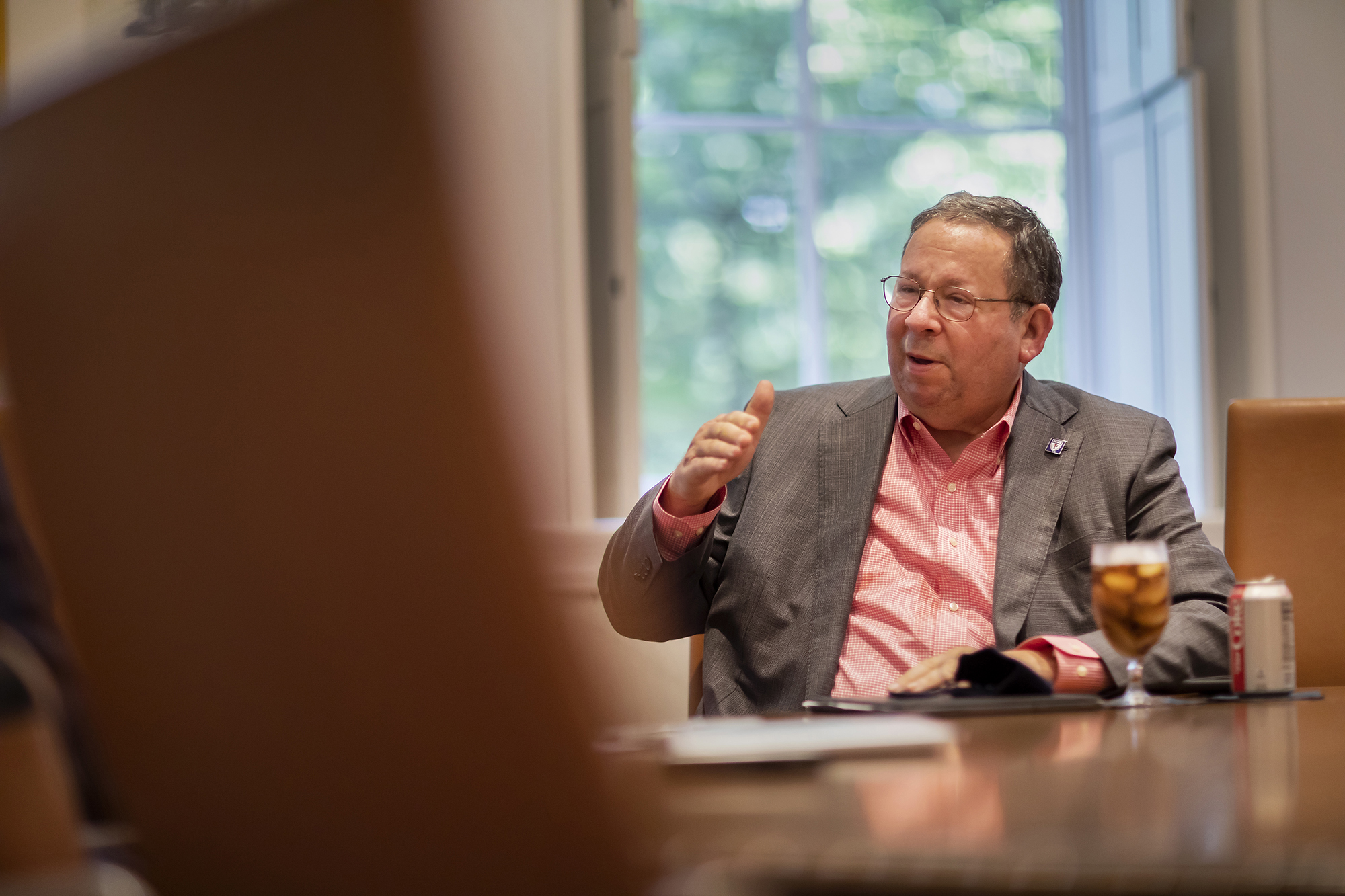 David Cohen talks in conference room.