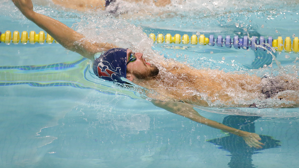 Keanan Dols does the backstroke during a competition.