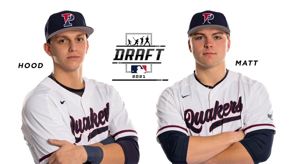 John Hood, left, and Peter matt wearing their Penn jerseys and fold their arms.