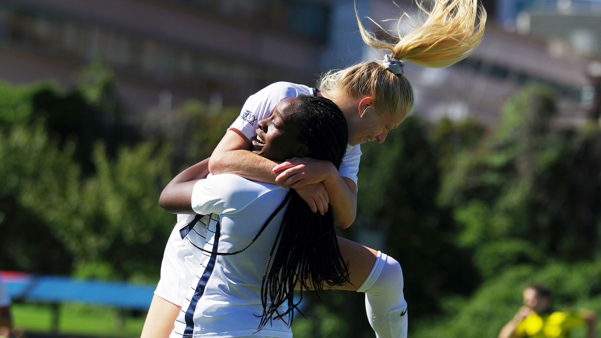 Freshman forward Janae Stewart (standing, holding her teammate) scored Penn’s first goal of the game. 