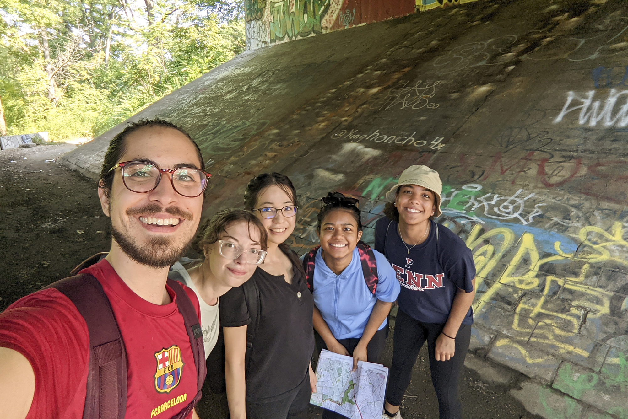 Pablo Cerdera, Anna Balfanz, Ayana Shirai, Abdul Razak, and Mya Gordon pose along the route from Cobbs Creek to City Avenue. 