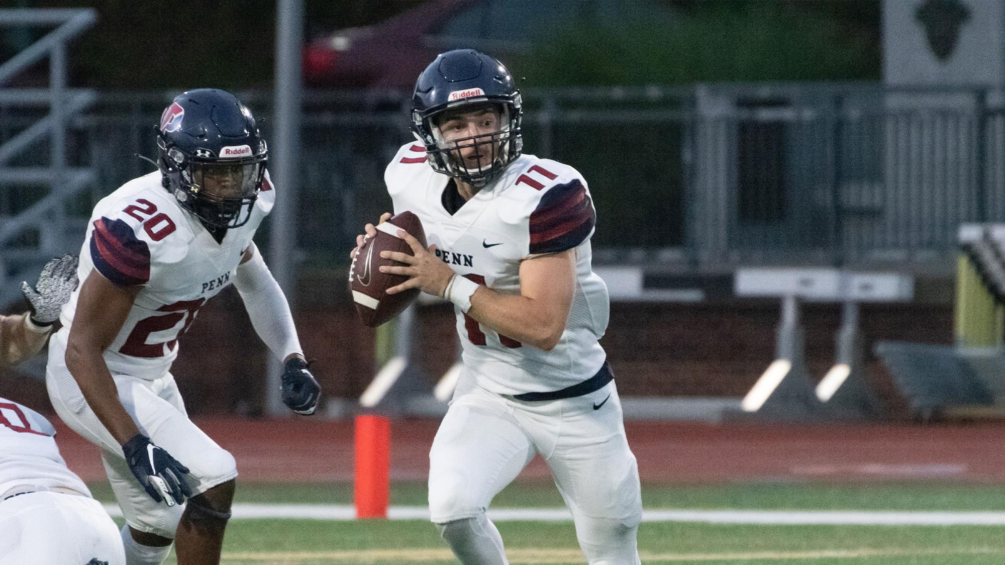 Junior quarterback Andrew Paolini rolls to the right on a pass play.