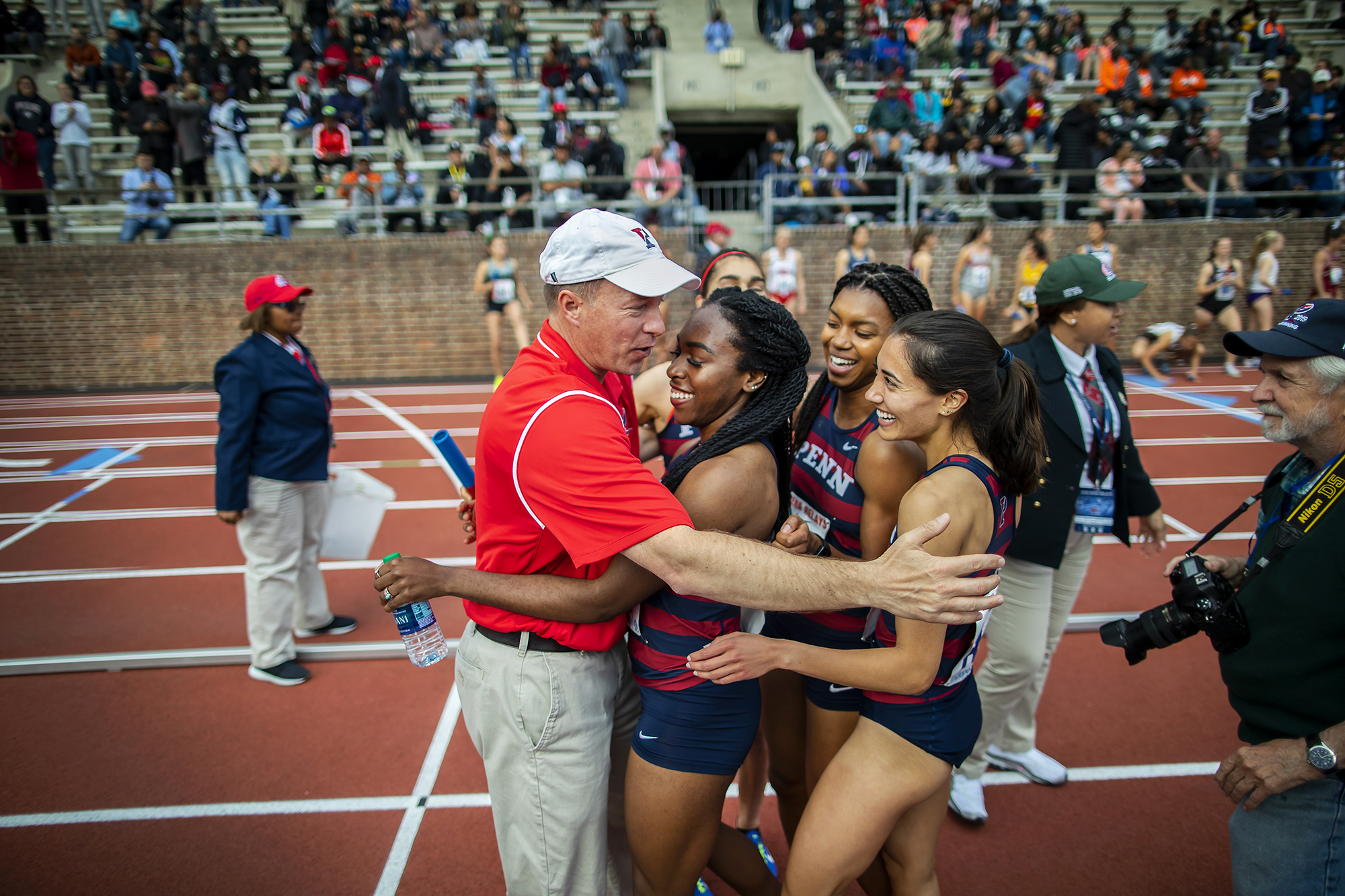 teve Dolan celebrates with Uchechi Nwogwugwu, Nia Akins, Melissa Tanaka, and Maddie Villalba after the quartet won the College Women’s Championship of America Distance Medley Relay at the 2019 Penn Relays. 
