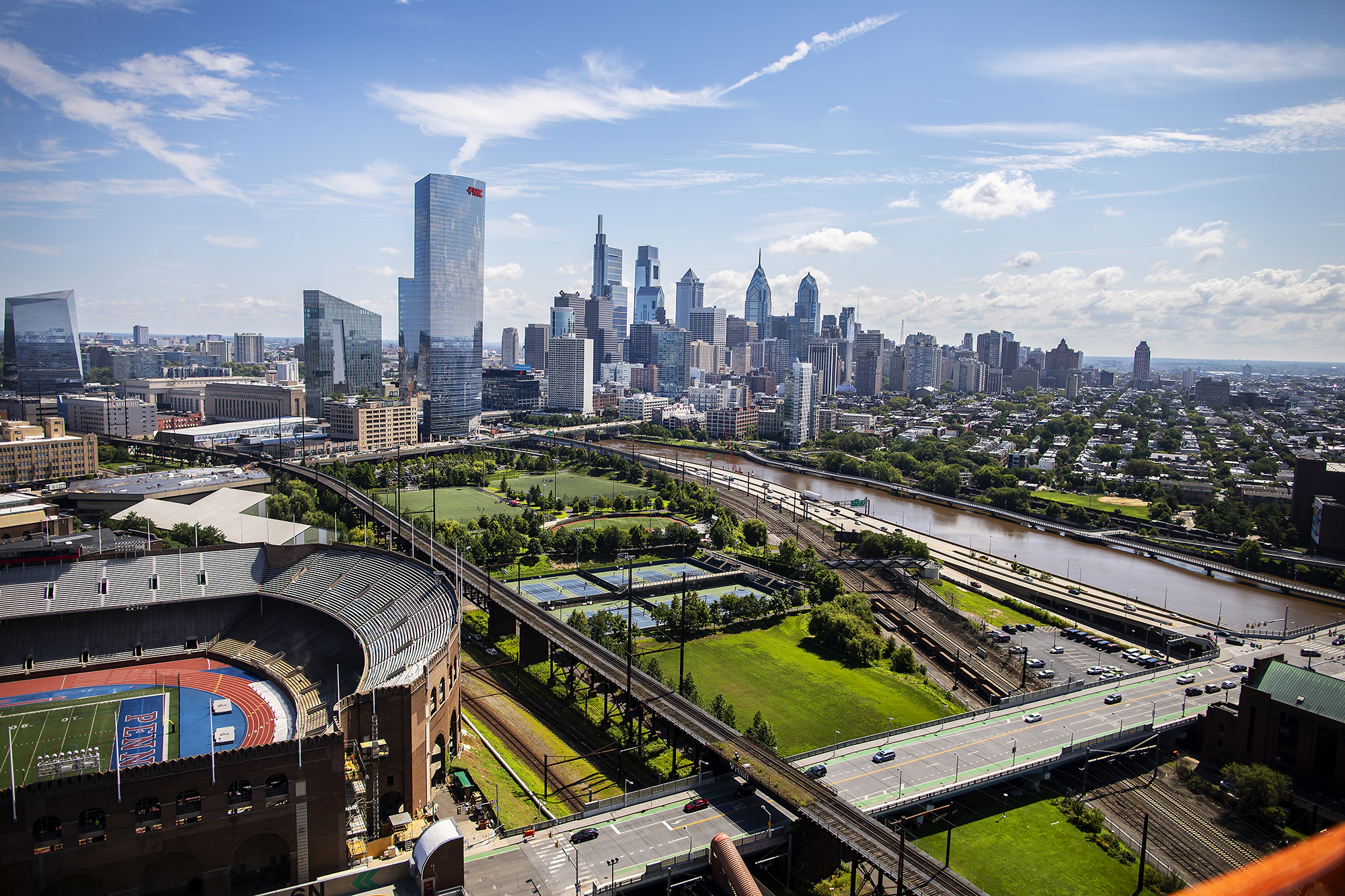 Franklin Field and Penn Park with the Philadelphia skyline in the background.