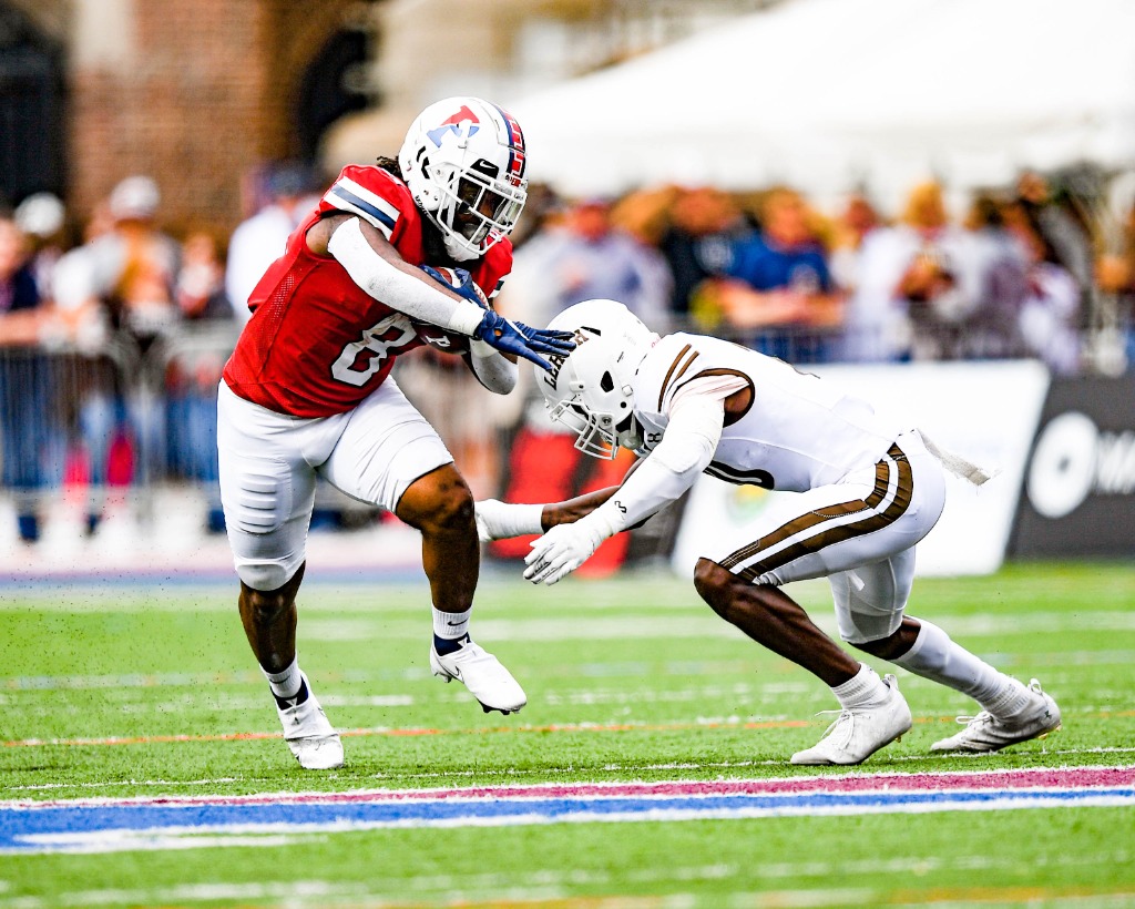 Senior running back Trey Flowers stiffarms a Lehigh defender.