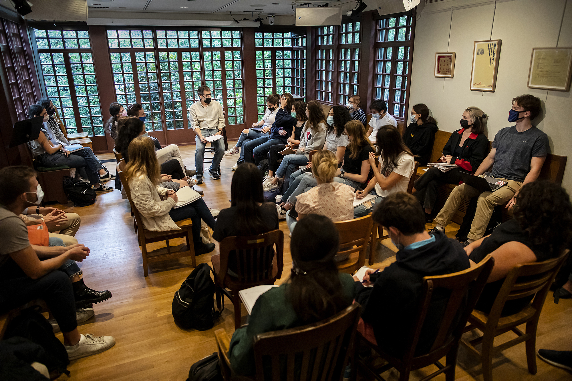 Al Filreis seated in a room full of students at the Kelly Writers House.