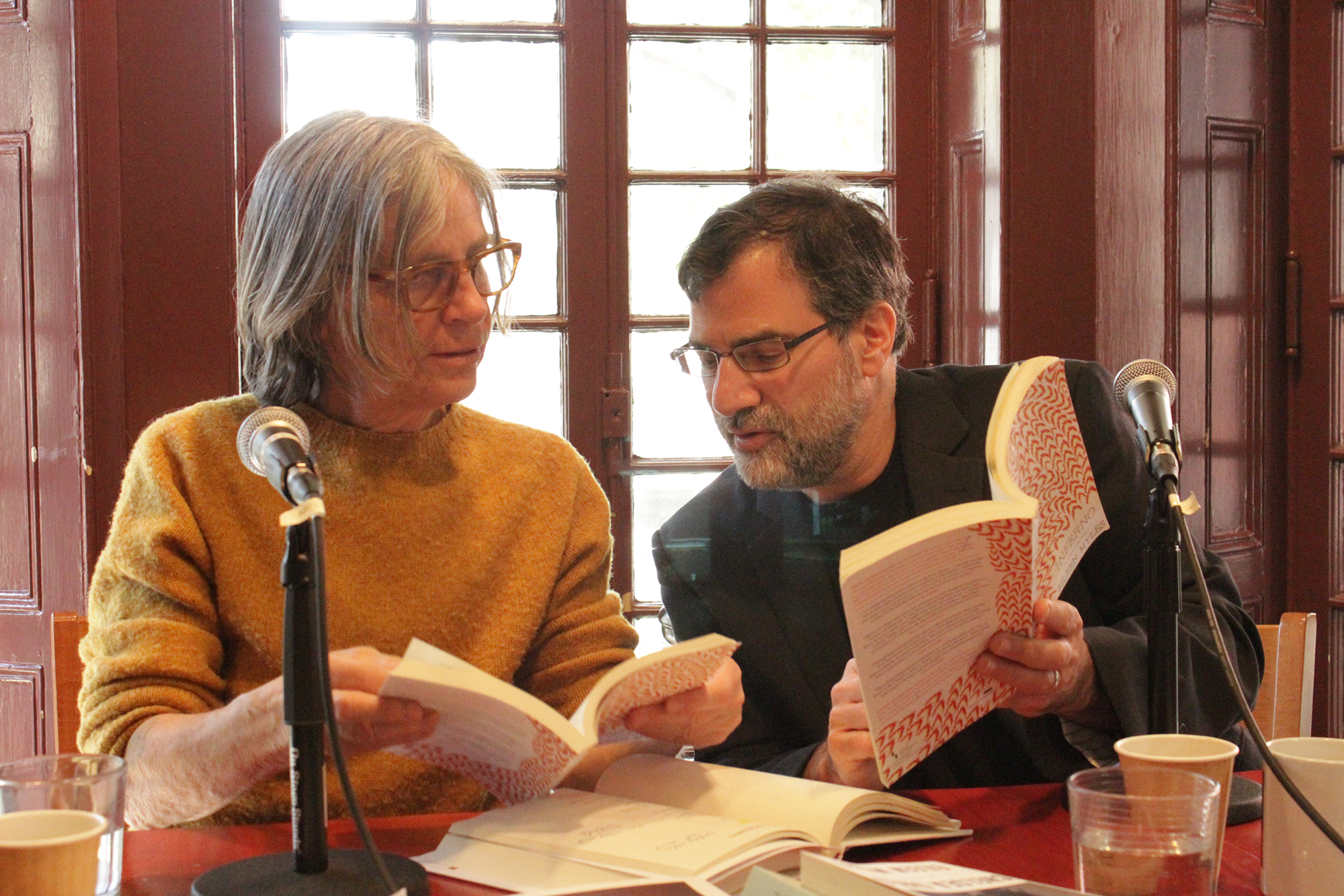 Eileen Myles and Al Filreis at a table at the Kelly Writers House.