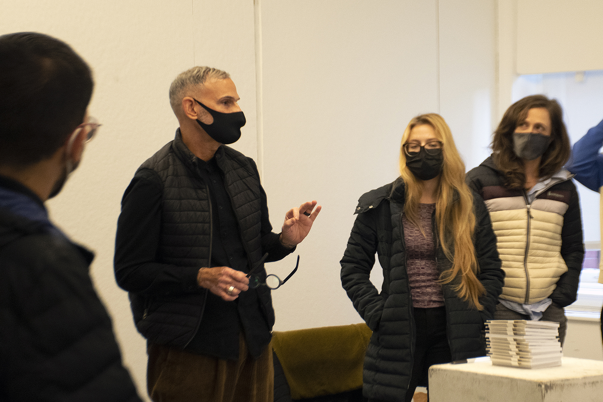 People in masks talk about an exercise in listening