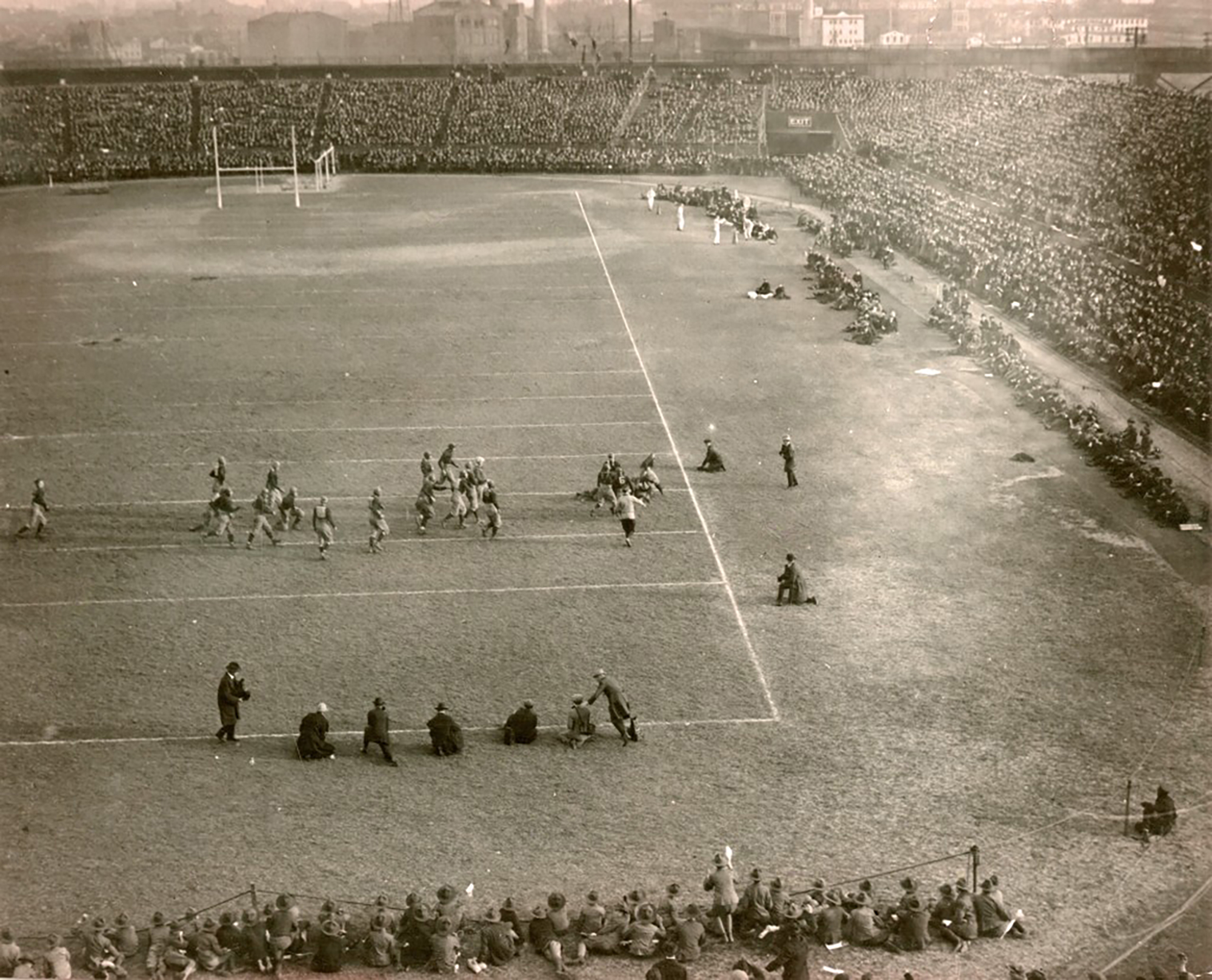 ooking east toward the Center City skyline from top of west end of the Franklin Field stands, the Penn football team takes on an unidentified team circa 1915. 