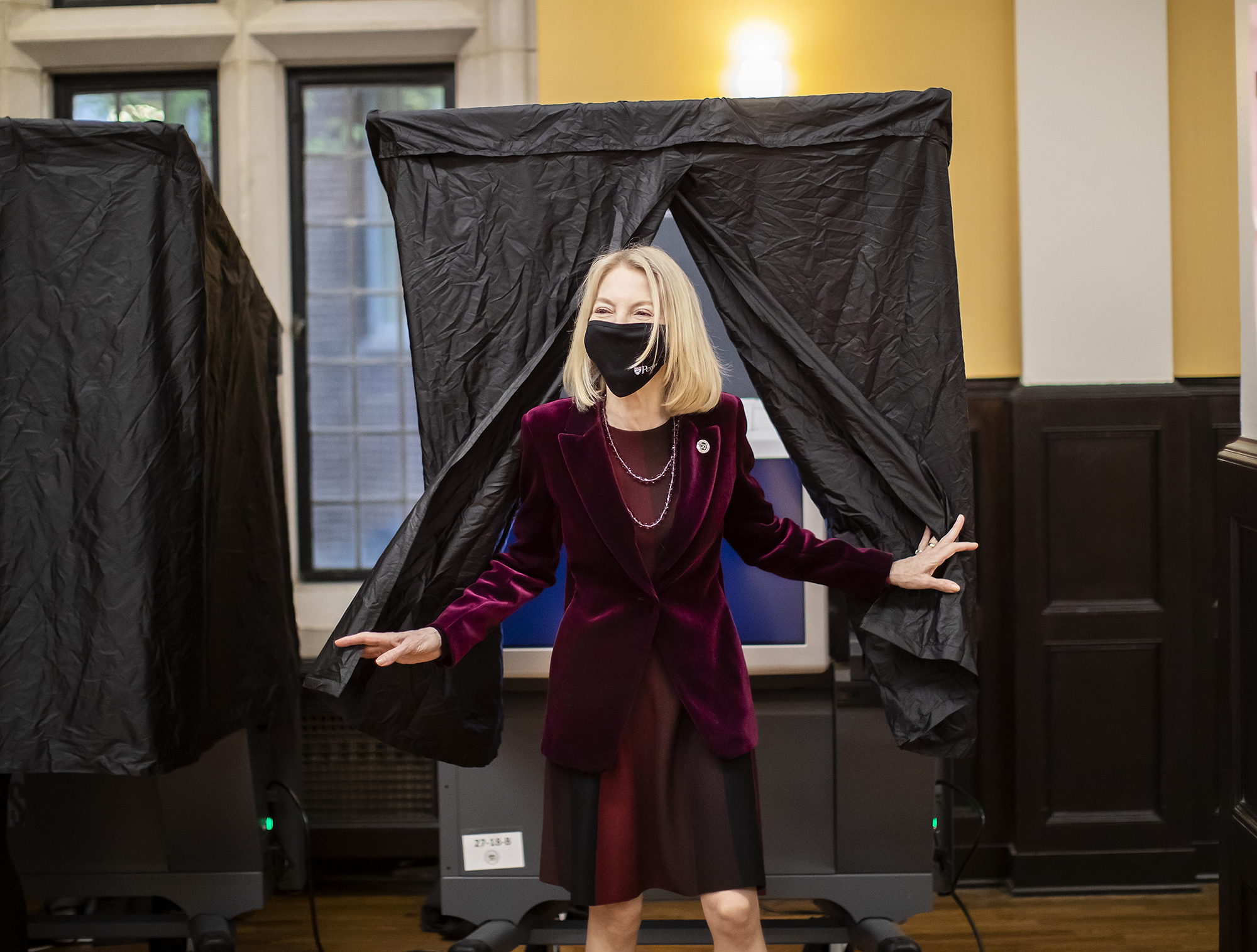 Amy Gutmann leaves voting booth