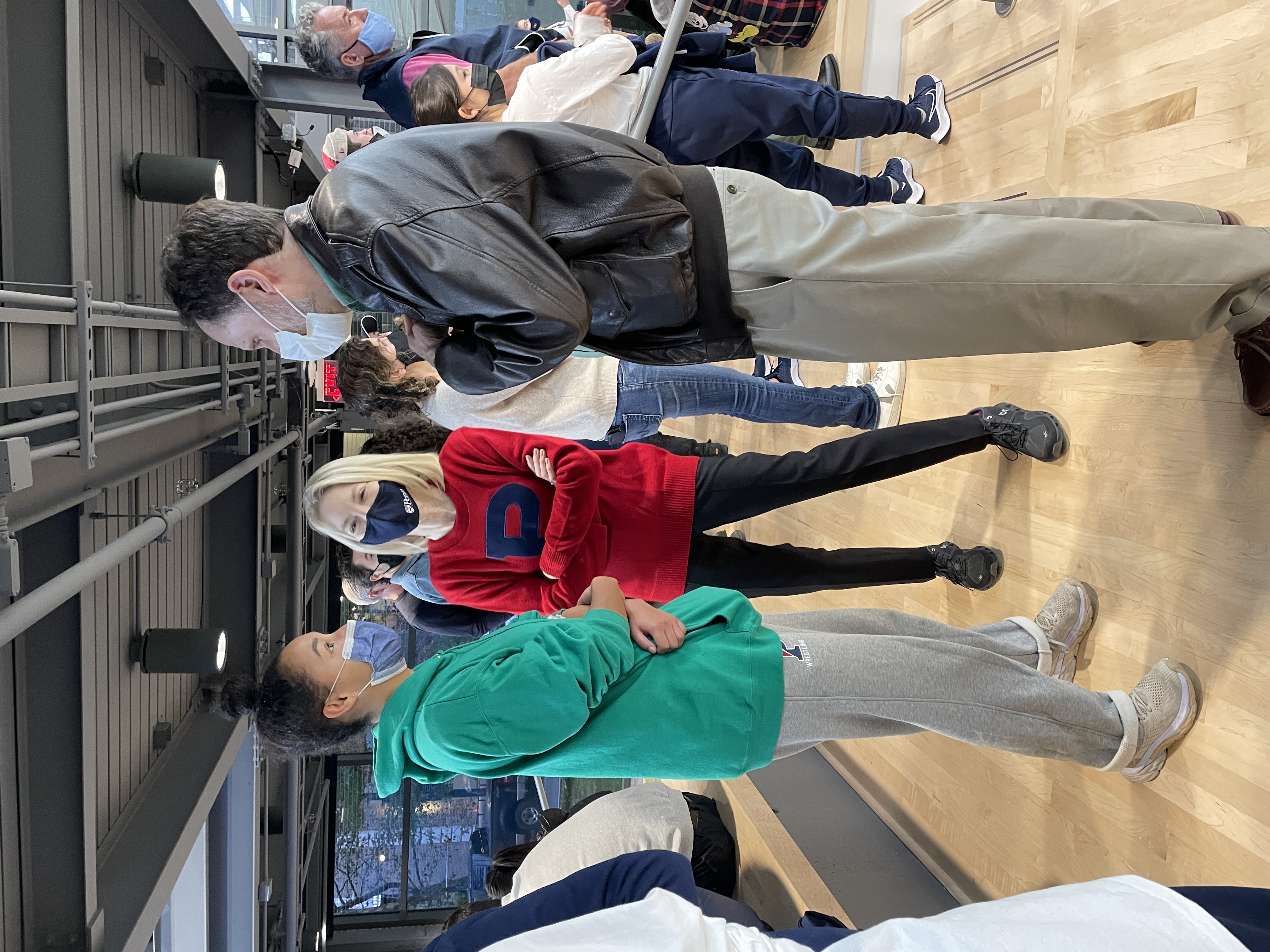 President Amy Gutmann and her husband Michael Doyle, a professor of international and public affairs at Columbia, converse with 2020 alumna and former All-American Jessica Davis at the Penn versus Drexel squash game on Saturday.