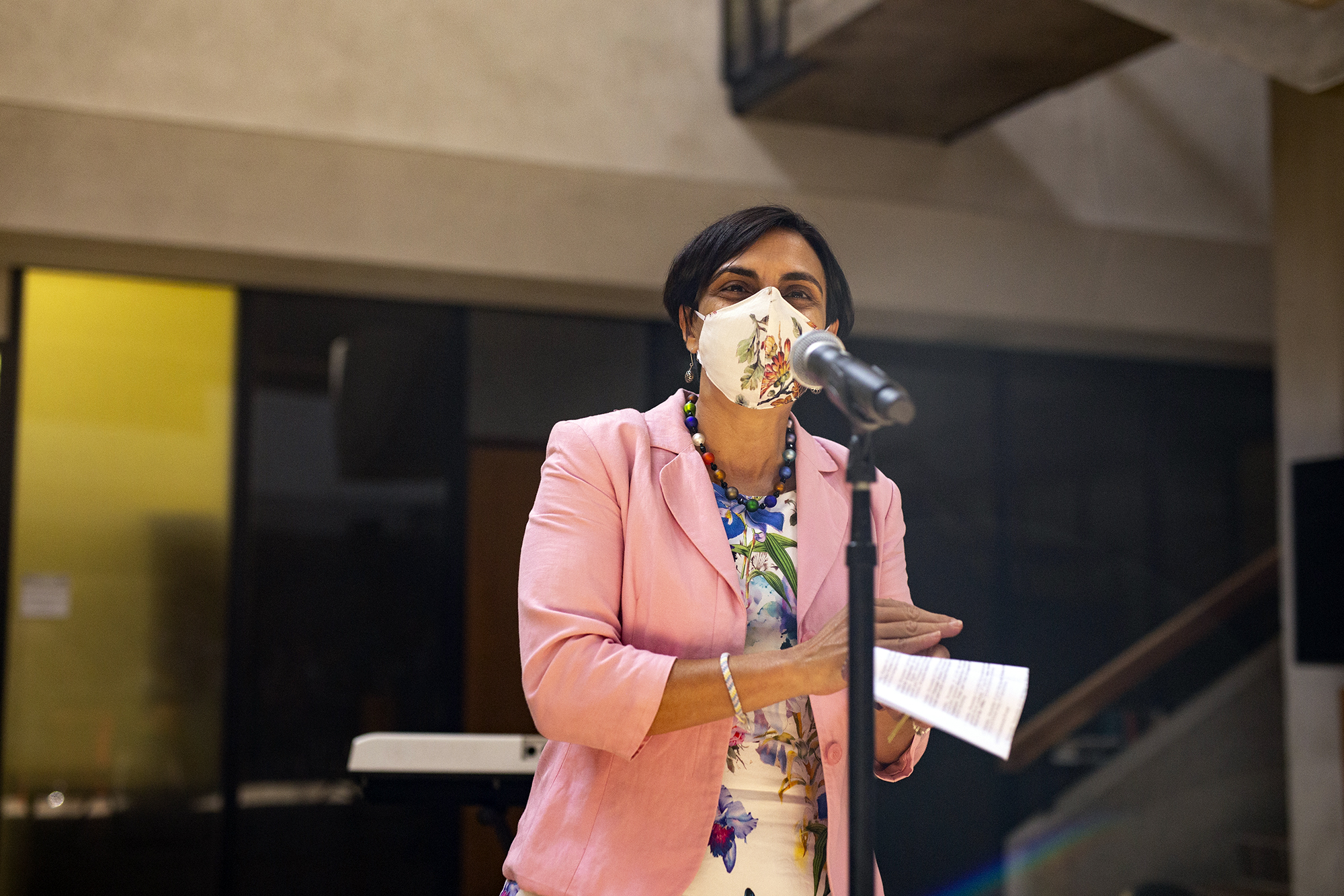 tulia falleti speaking at a microphone