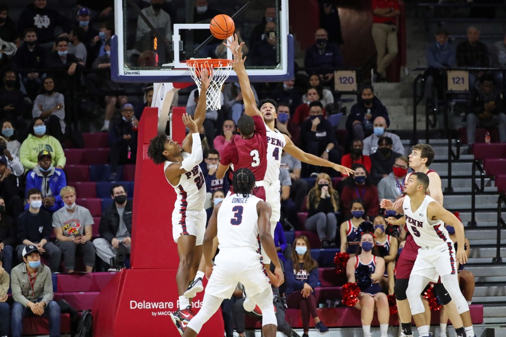 Penn basketball players battle near the basket at the Palestra.