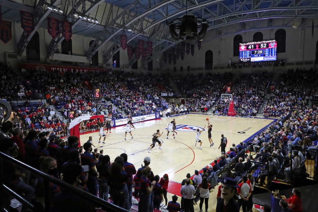The men's basketball team takes on an opponent at a packed Palestra.