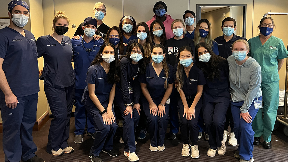 Group of Penn Dental students wearing face masks posing as a group.