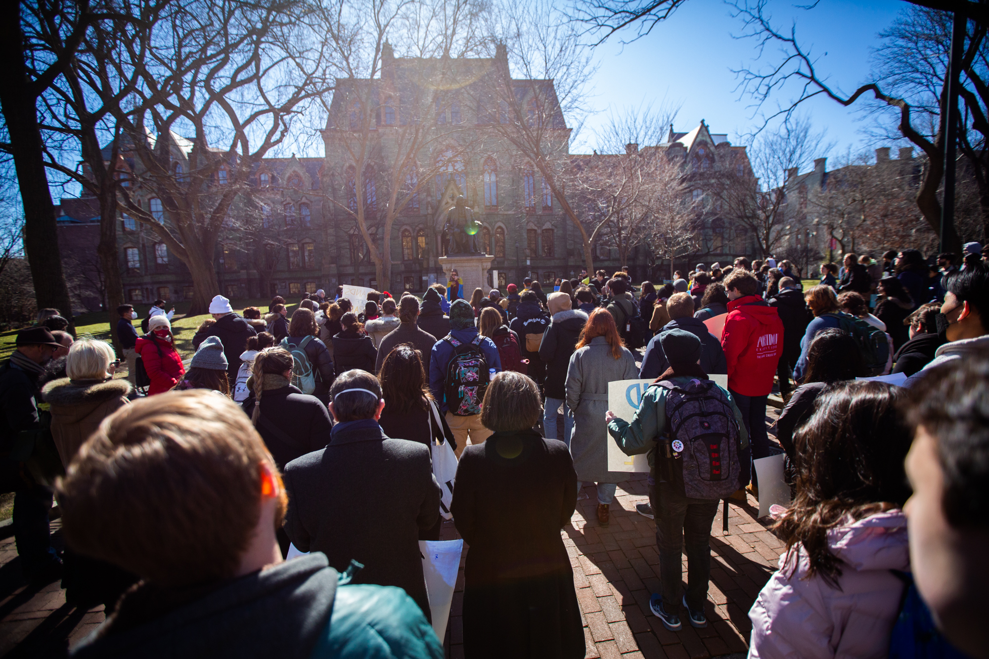 A large crowd in support of Ukraine standing in front of College Hall.