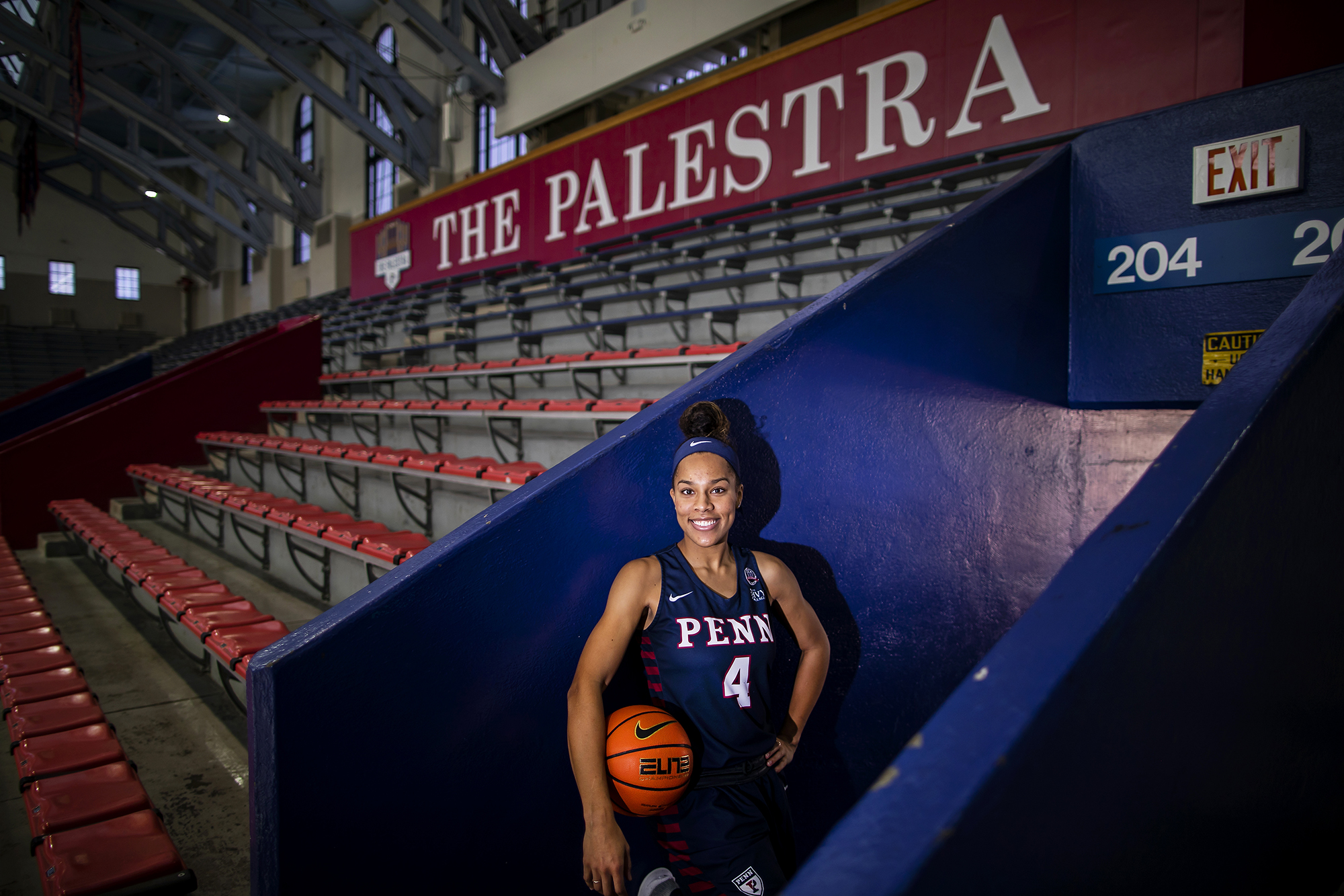 Suttle holds a basketball while standing in a passageway at the Palestra.