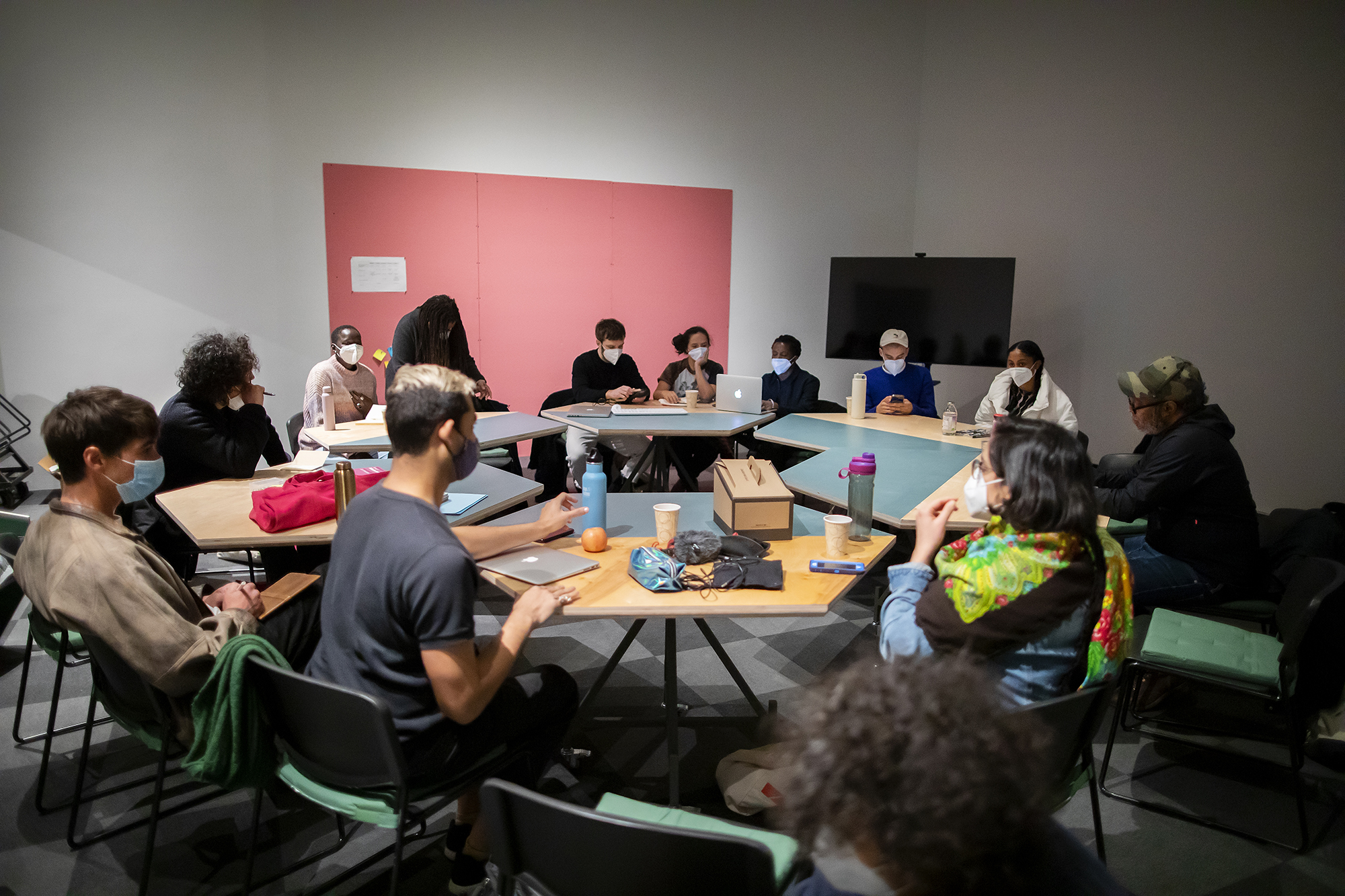Roundtable of students inside a gallery space