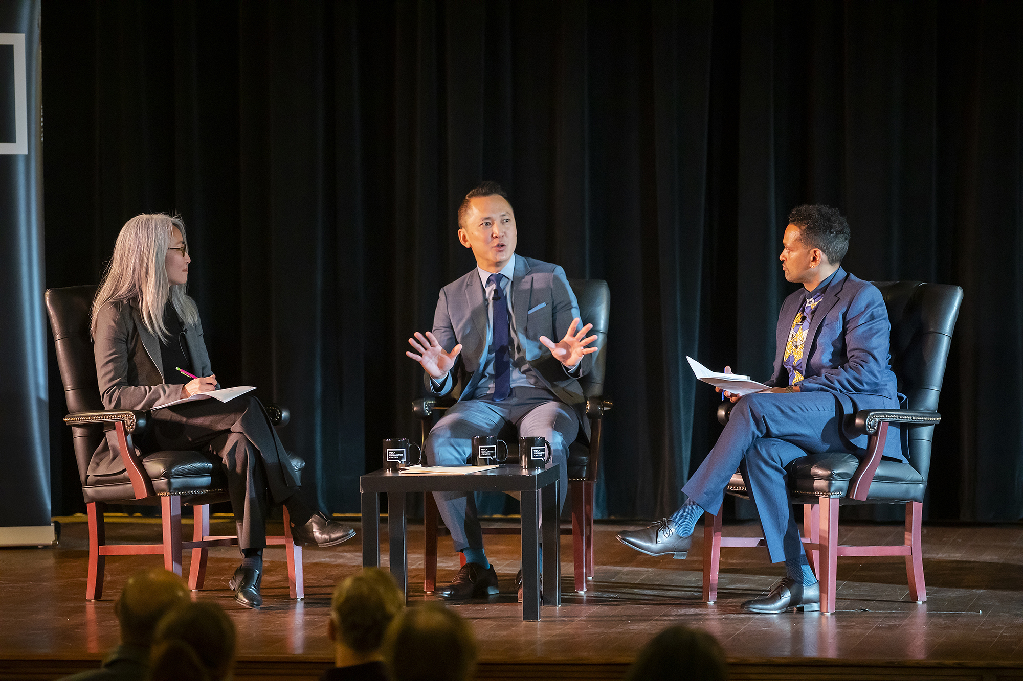 Panelists sitting on stage