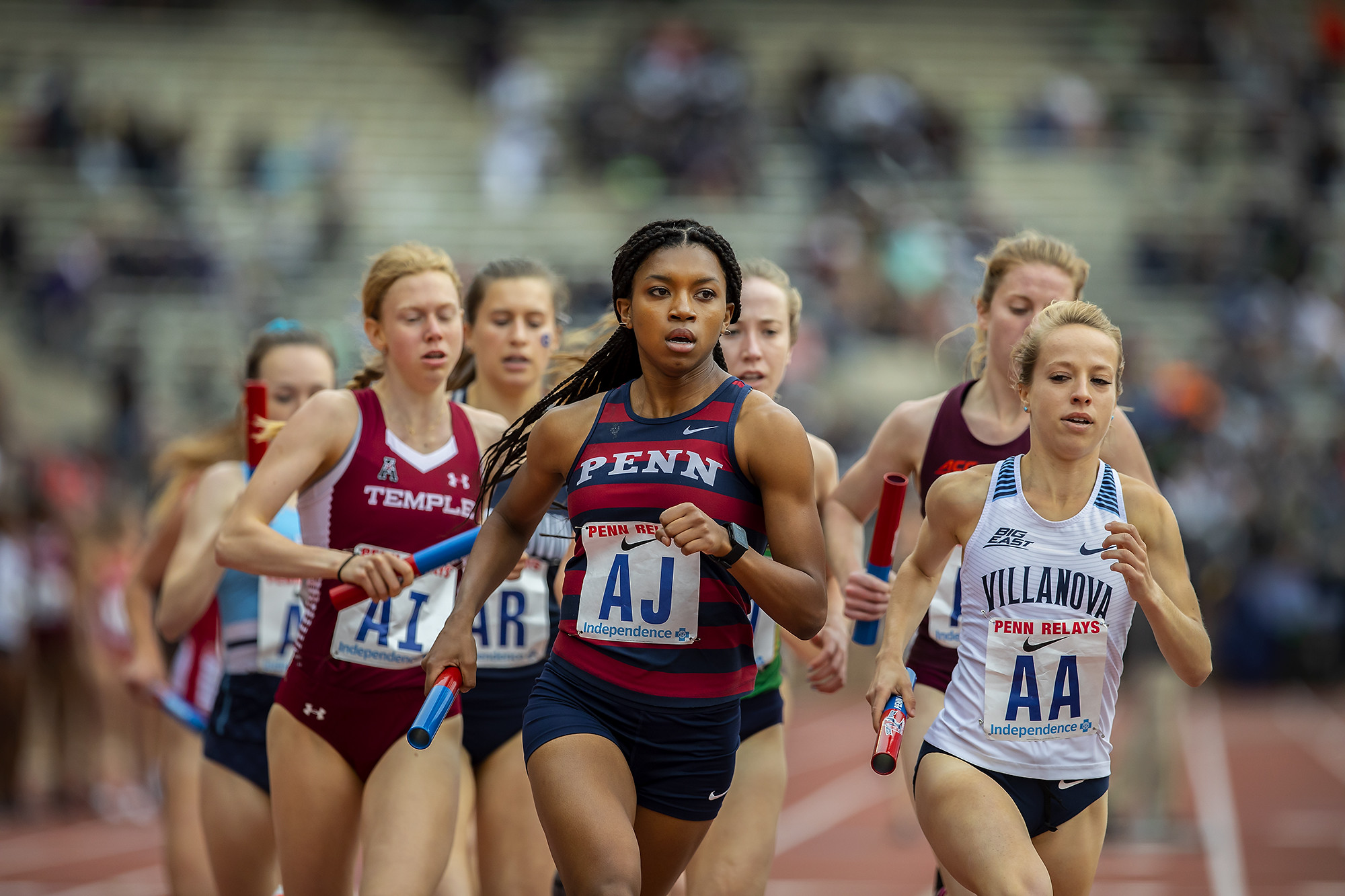 Nia Akins lead the pack during a race at the Penn Relays.