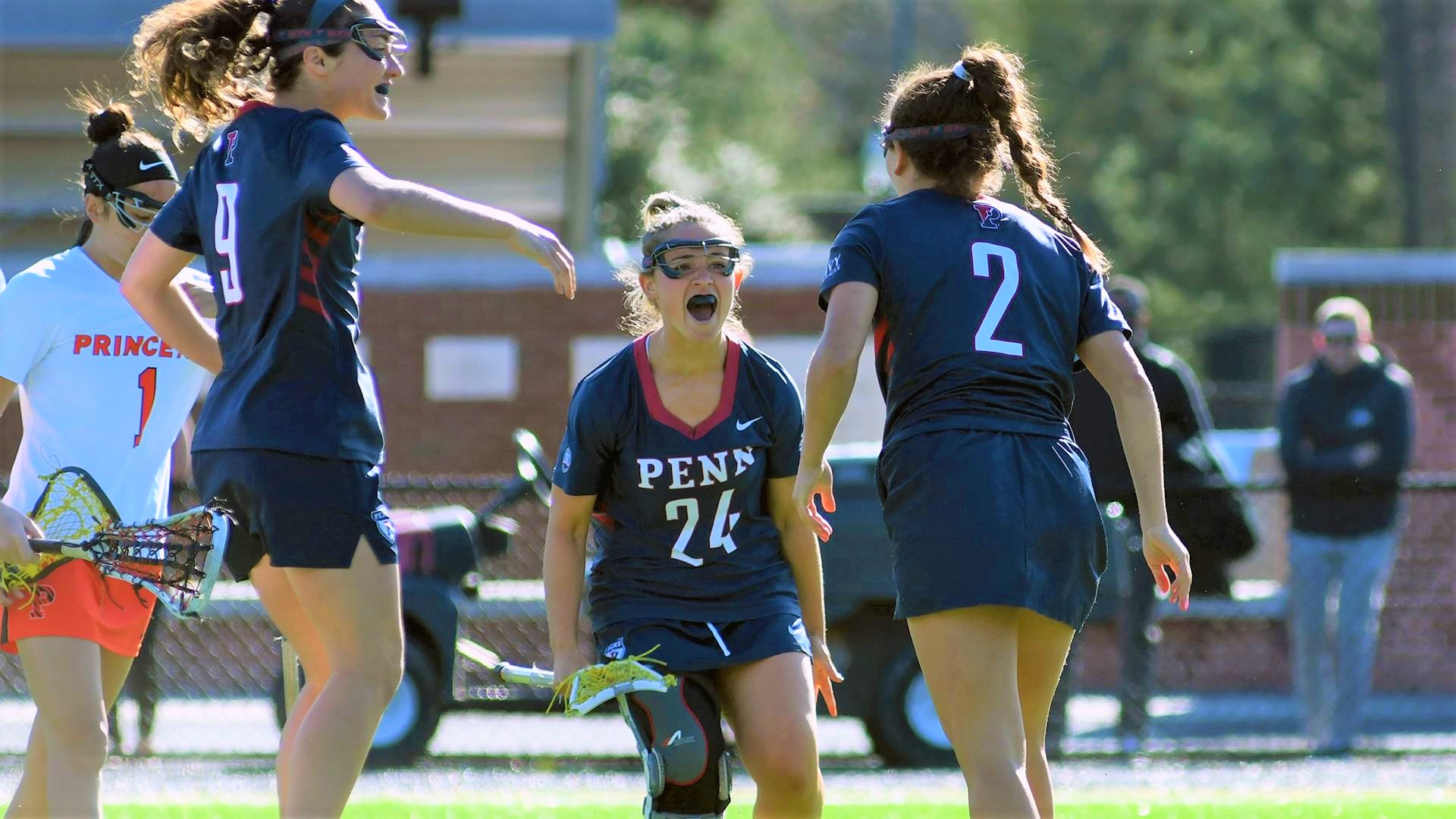 Keeley Block, center, celebratres with two teammates after a goal.