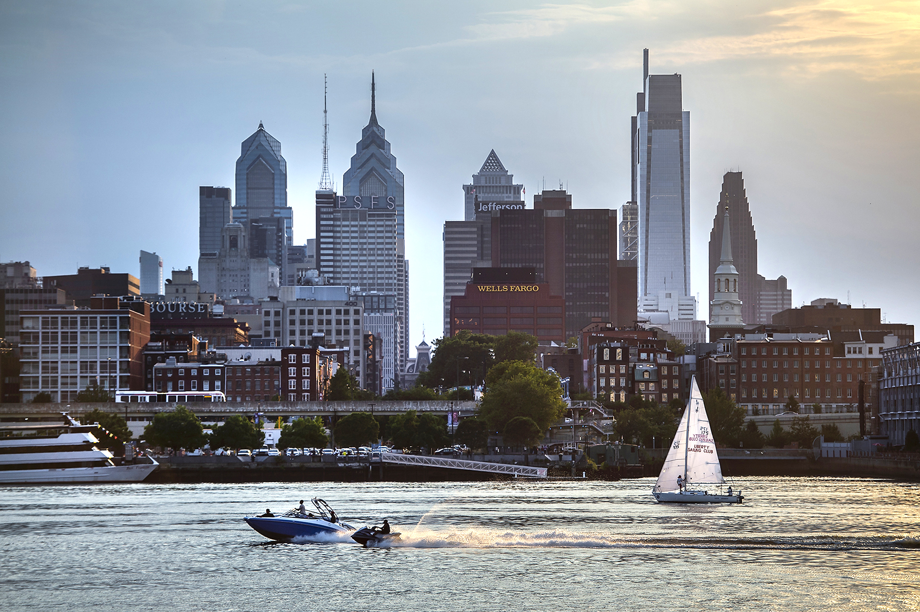 delaware river with the philly skyline and a sailboat