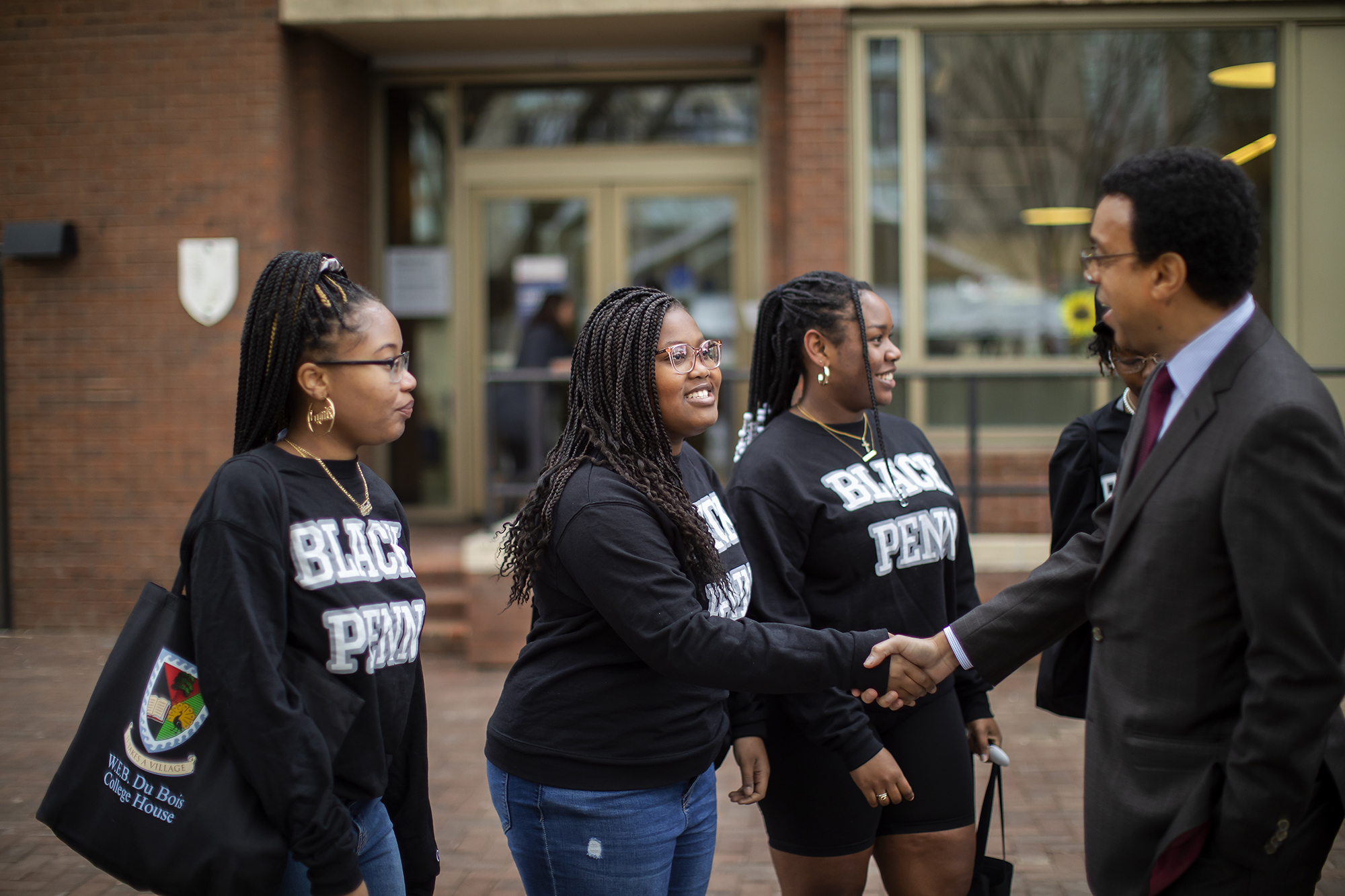 interim president wendell pritchett greets students