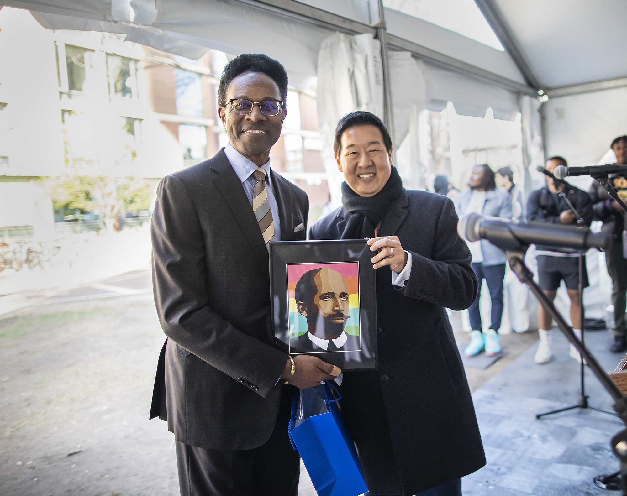 Karu with Will Gipson holding an image of W.E.B. Du Bois