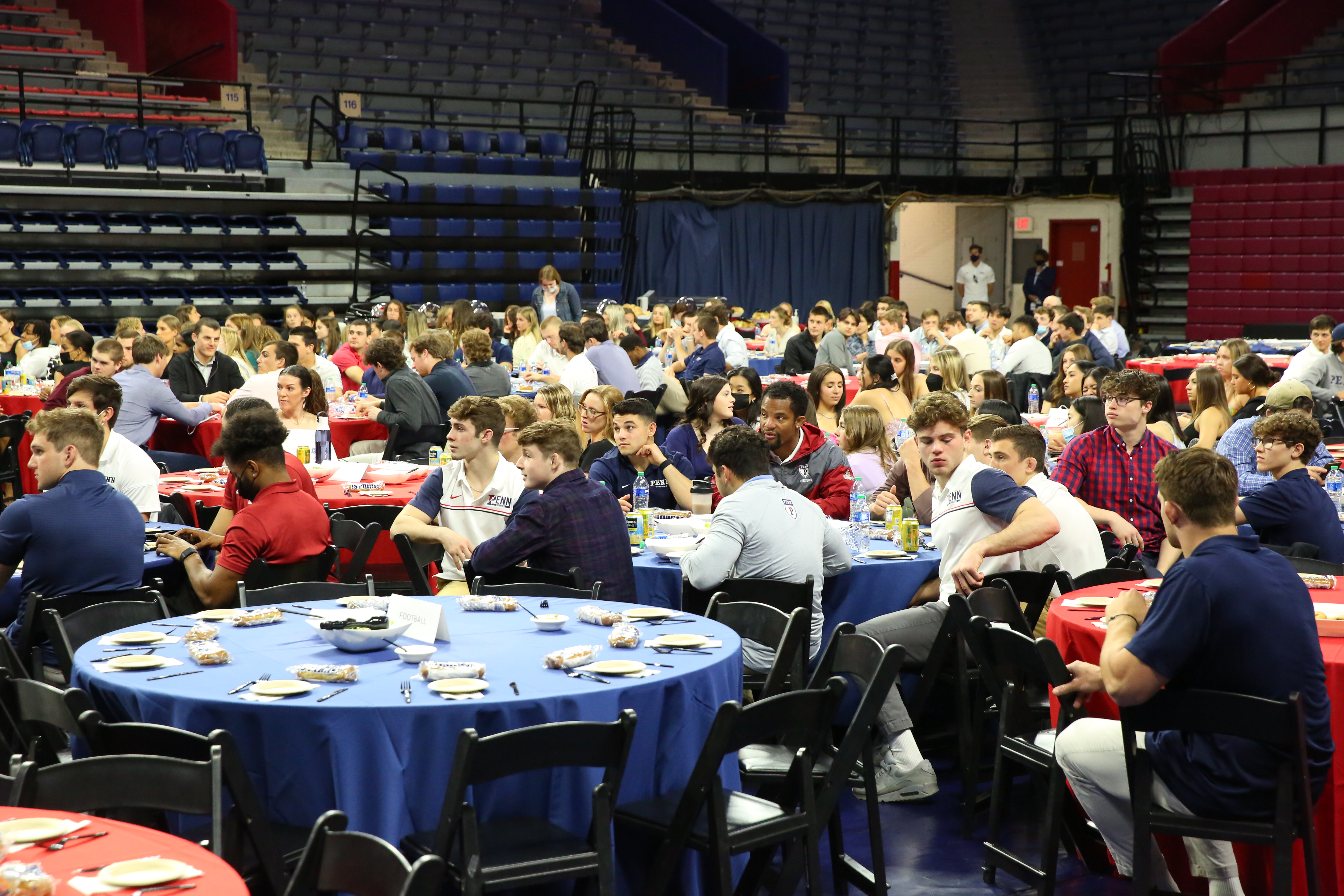 Attendees sit at tables on the Palestra floor during the awards ceremony.