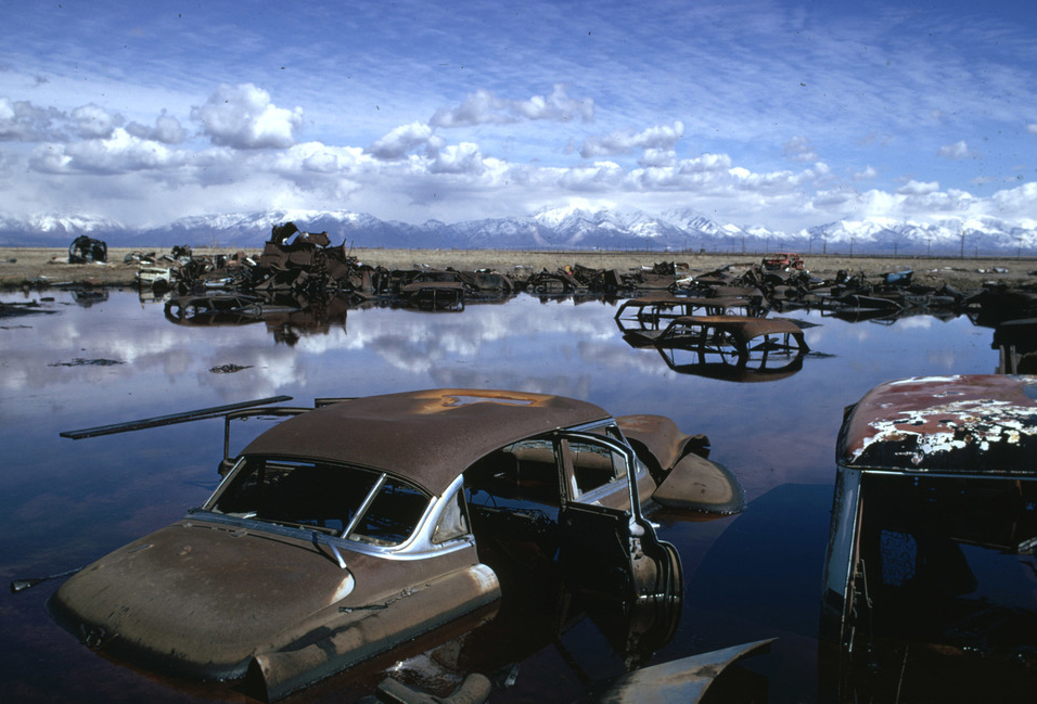 epa cleanup with rusty cars in water