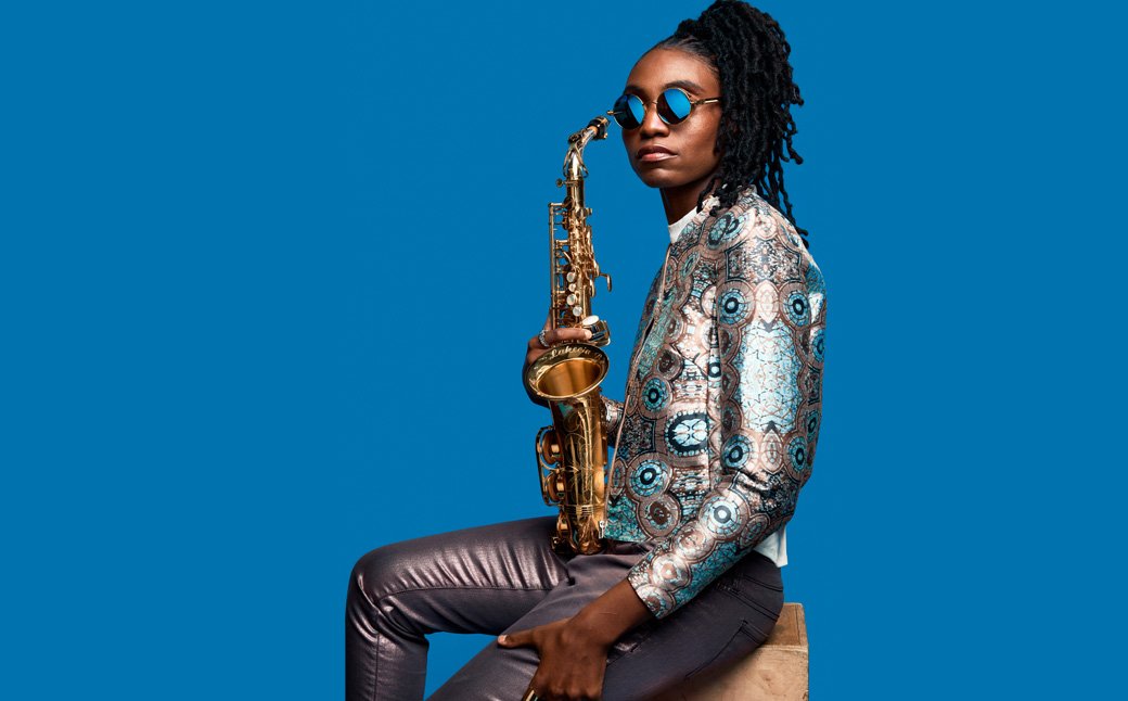 Lakecia Benjamin holds saxophone