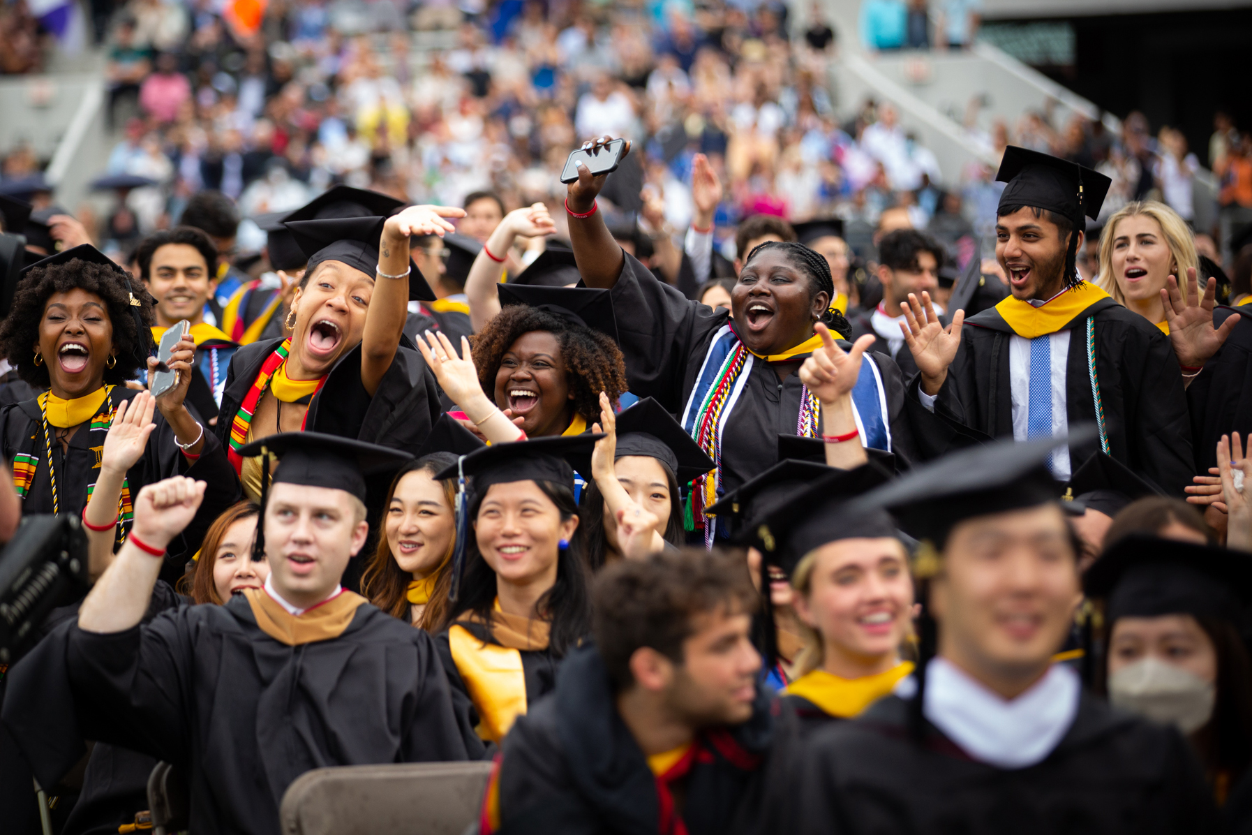 graduates celebrate on franklin field