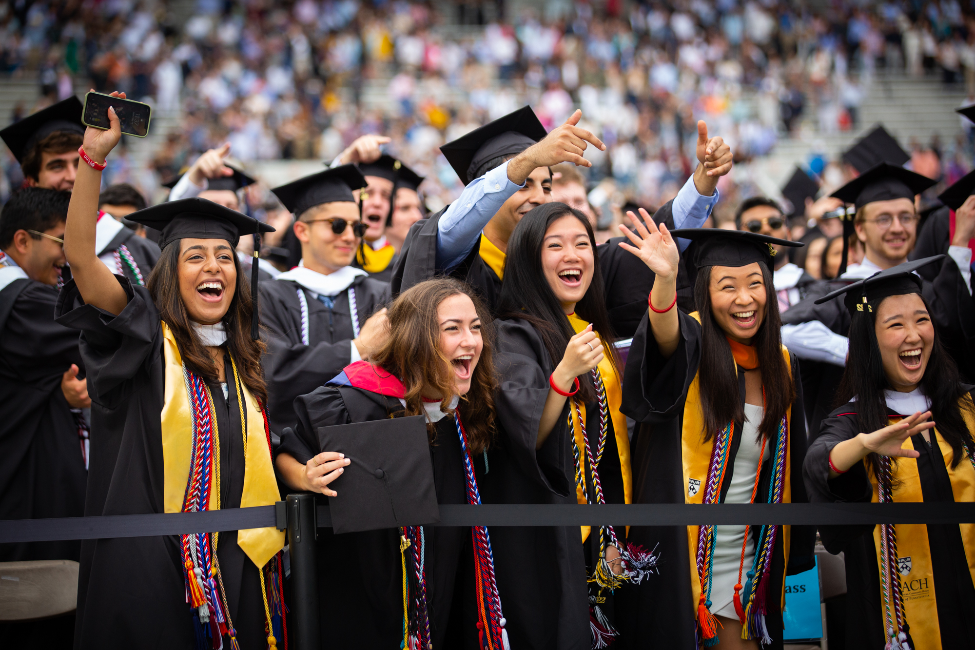 students celebrating at penn commencement