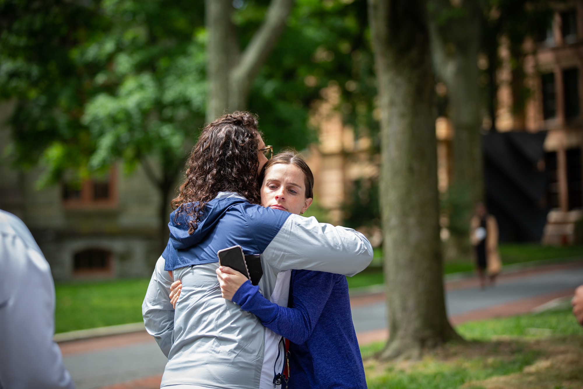 Two people hug on College Green during Penn’s gun violence vigil.