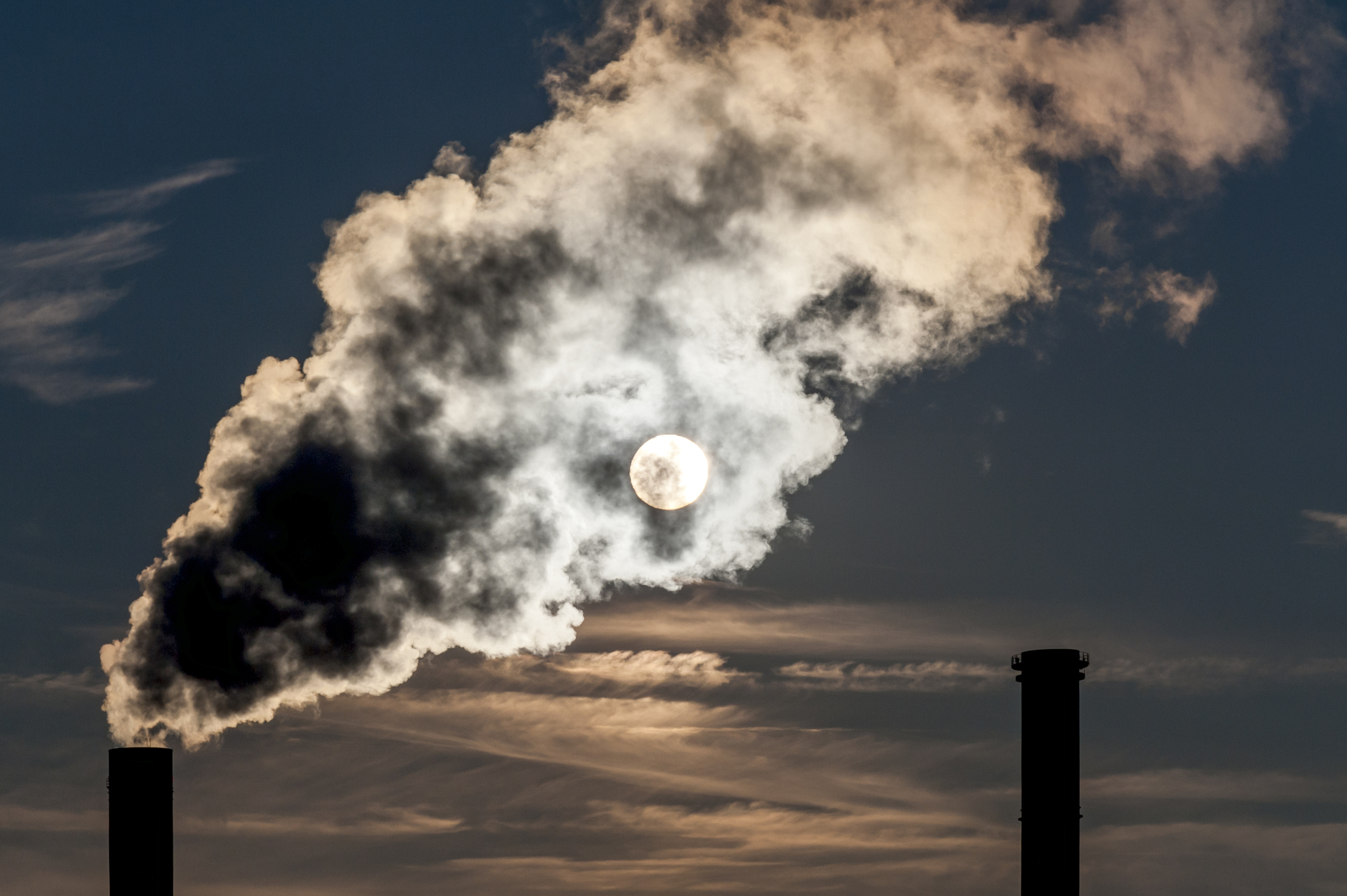 Smoke from a power plant clouds out the sun's light