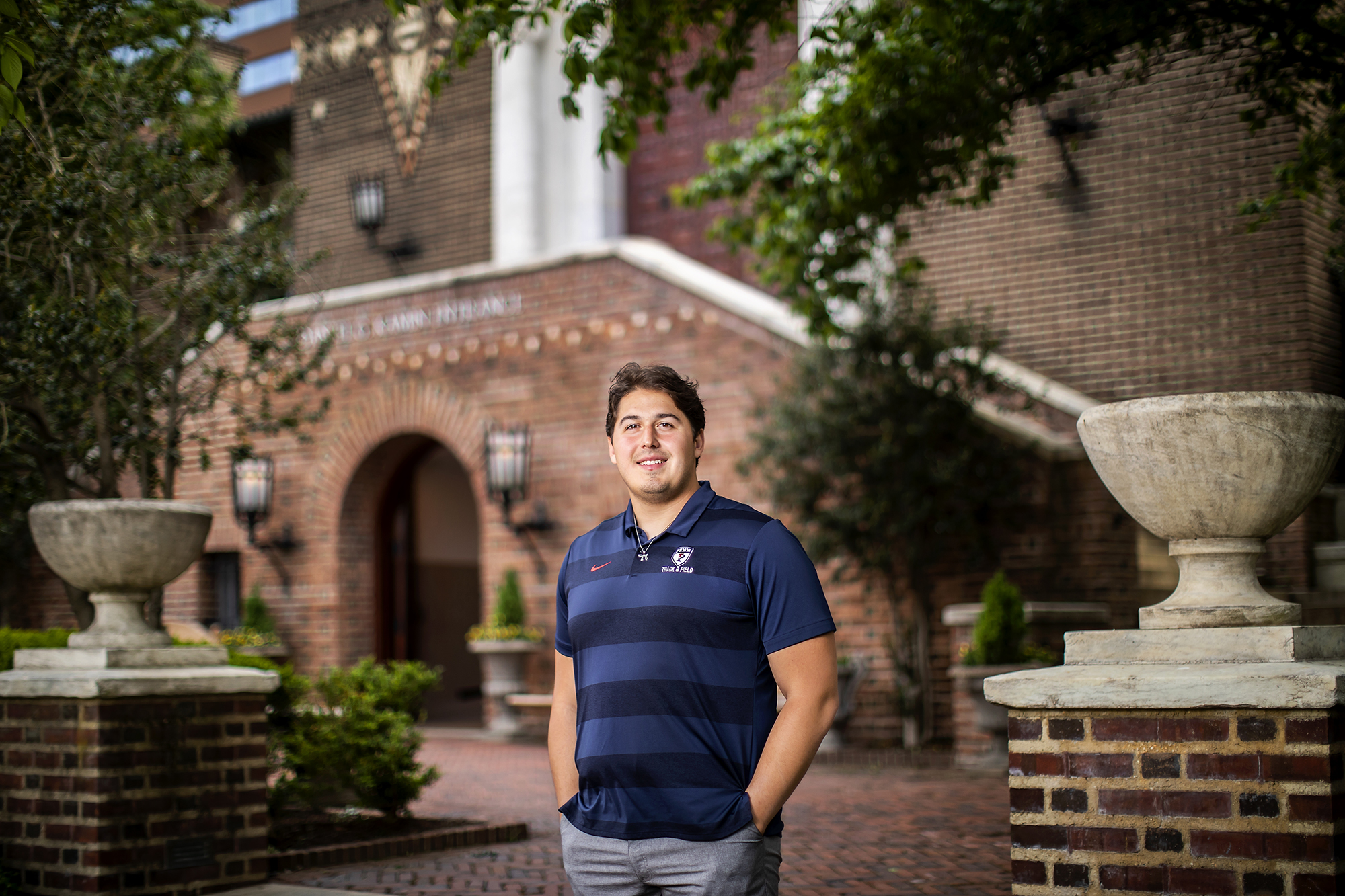 Thrower Cam Landis stands in front of the Penn Museum, where the anthropology museum is based.