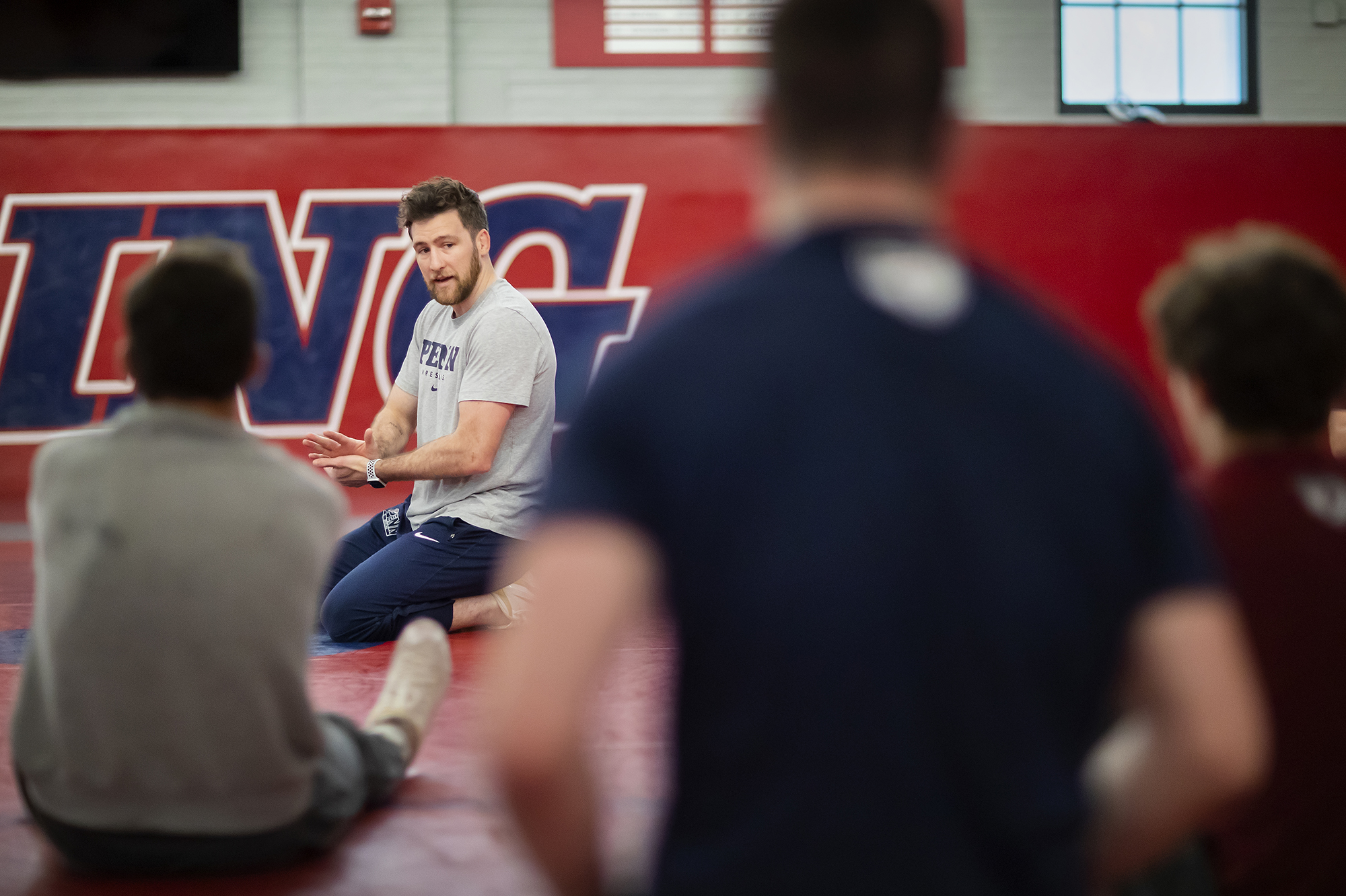 wrestling coach trains students