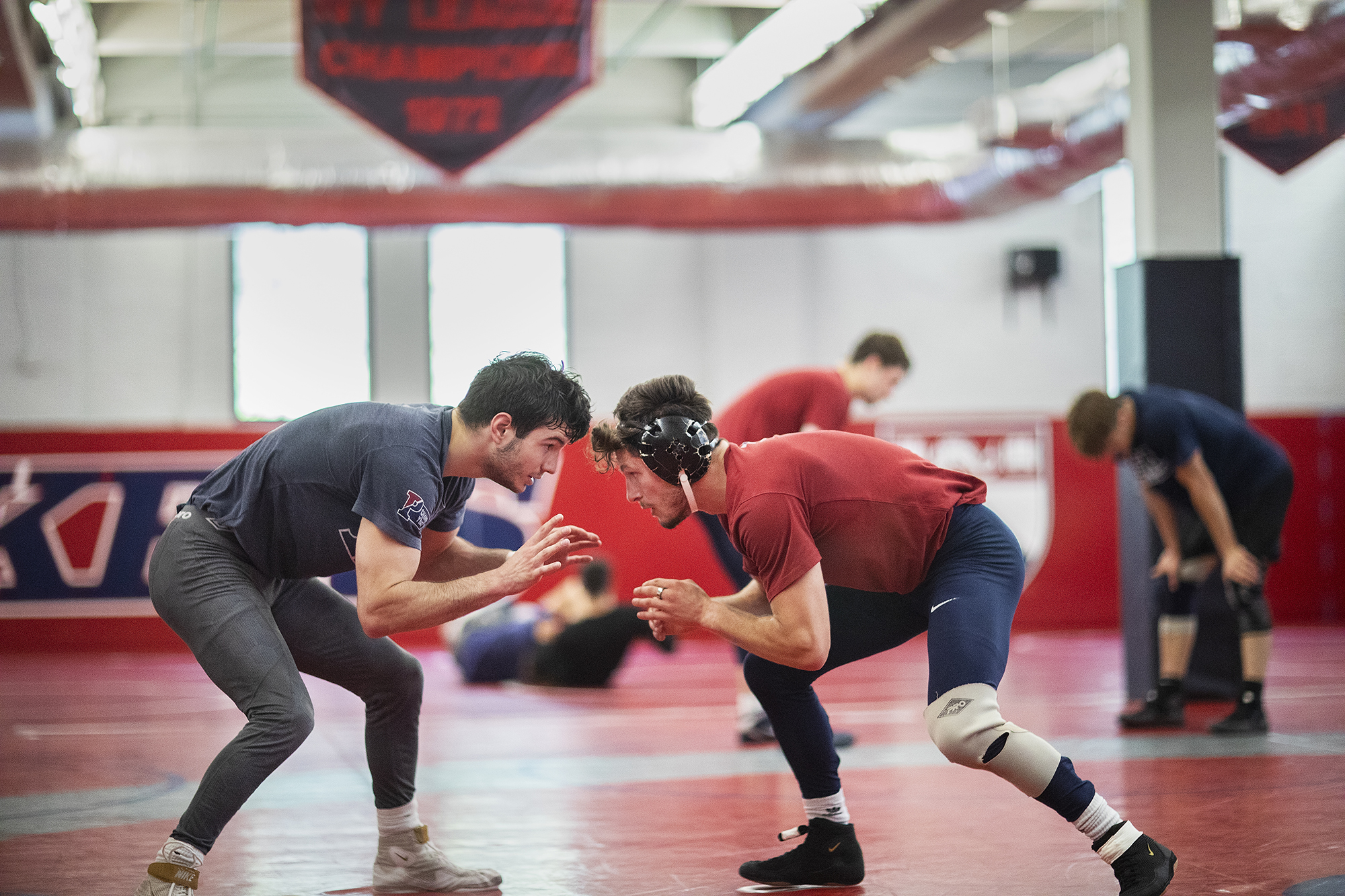 wrestling athletes on the mat in the training center