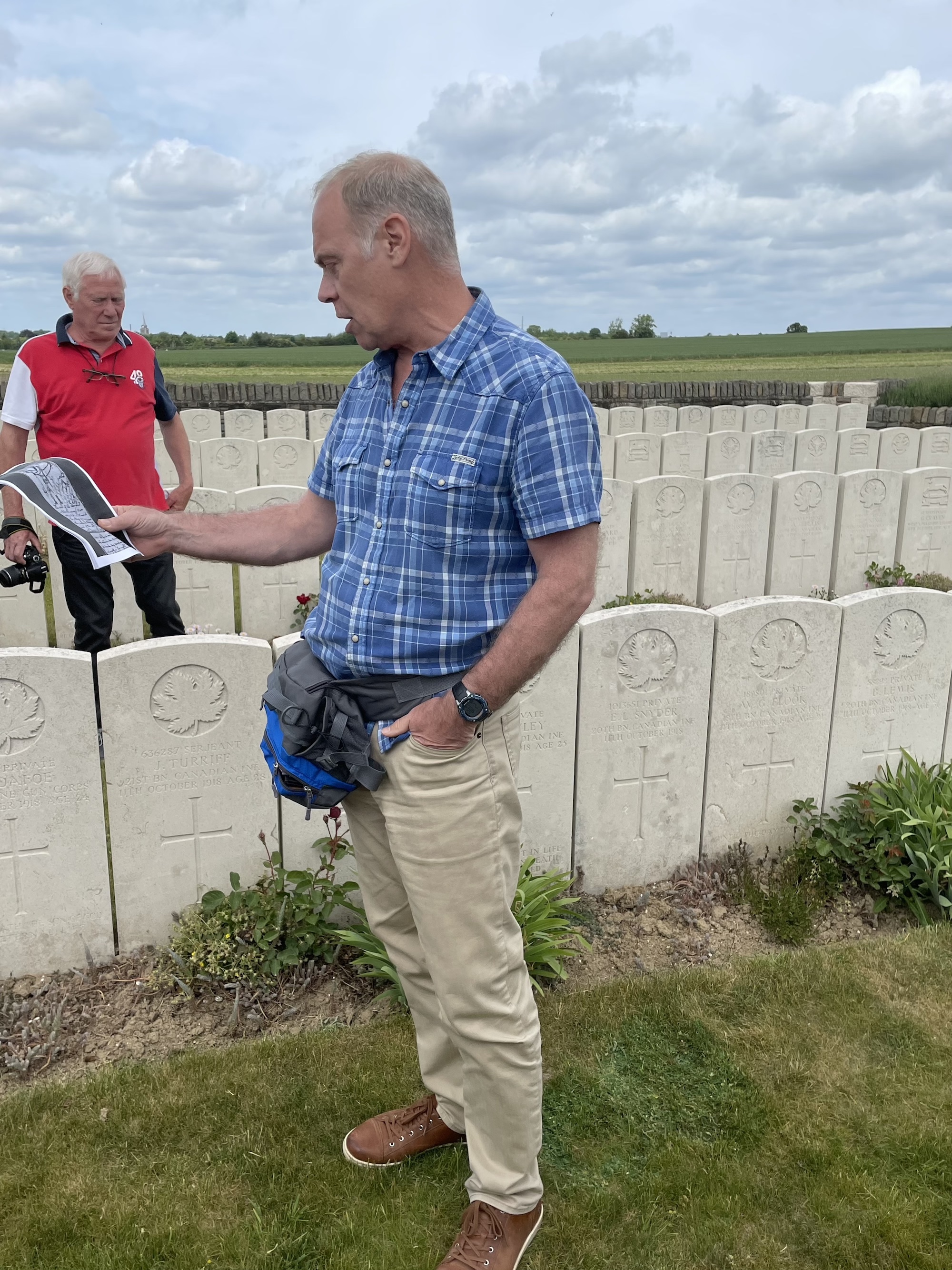 Prof. Warren Breckman reads from his grandfather's diary in a field near Iwuy, France