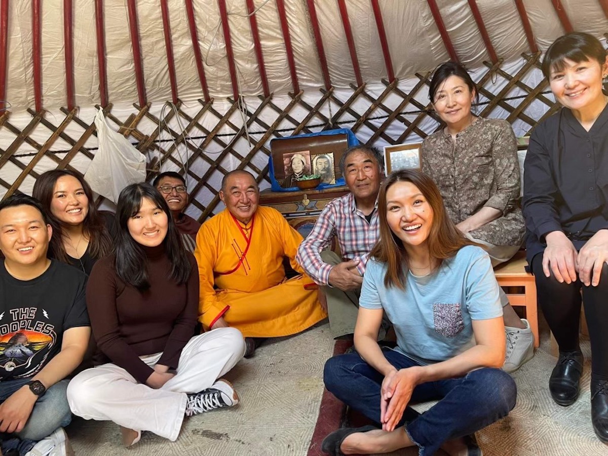 Azzaya Galsandum sits with aunts, uncles and cousins in a ger in Mongolia.