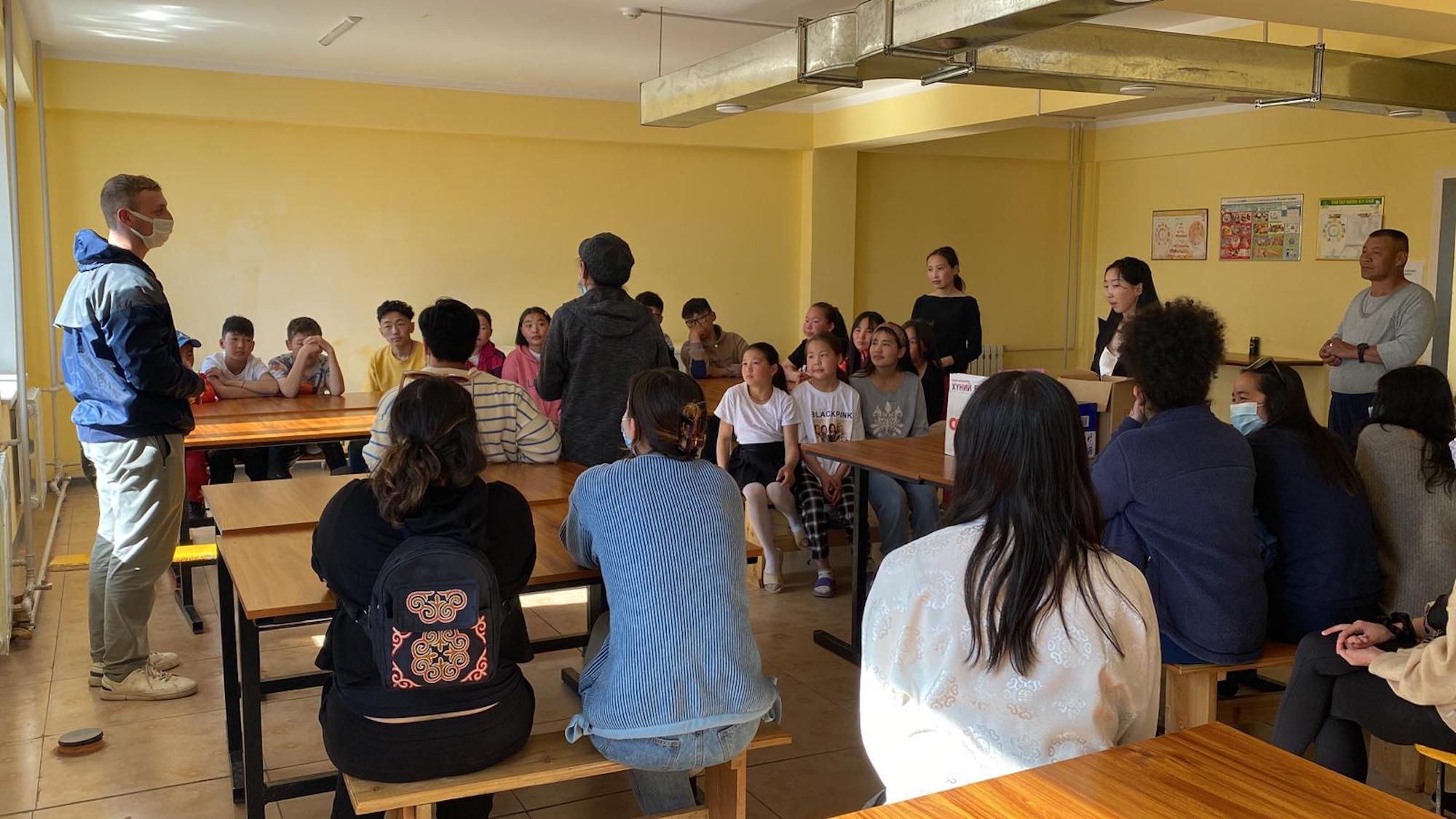 Penn students chat with children at a boarding school in Mongolia