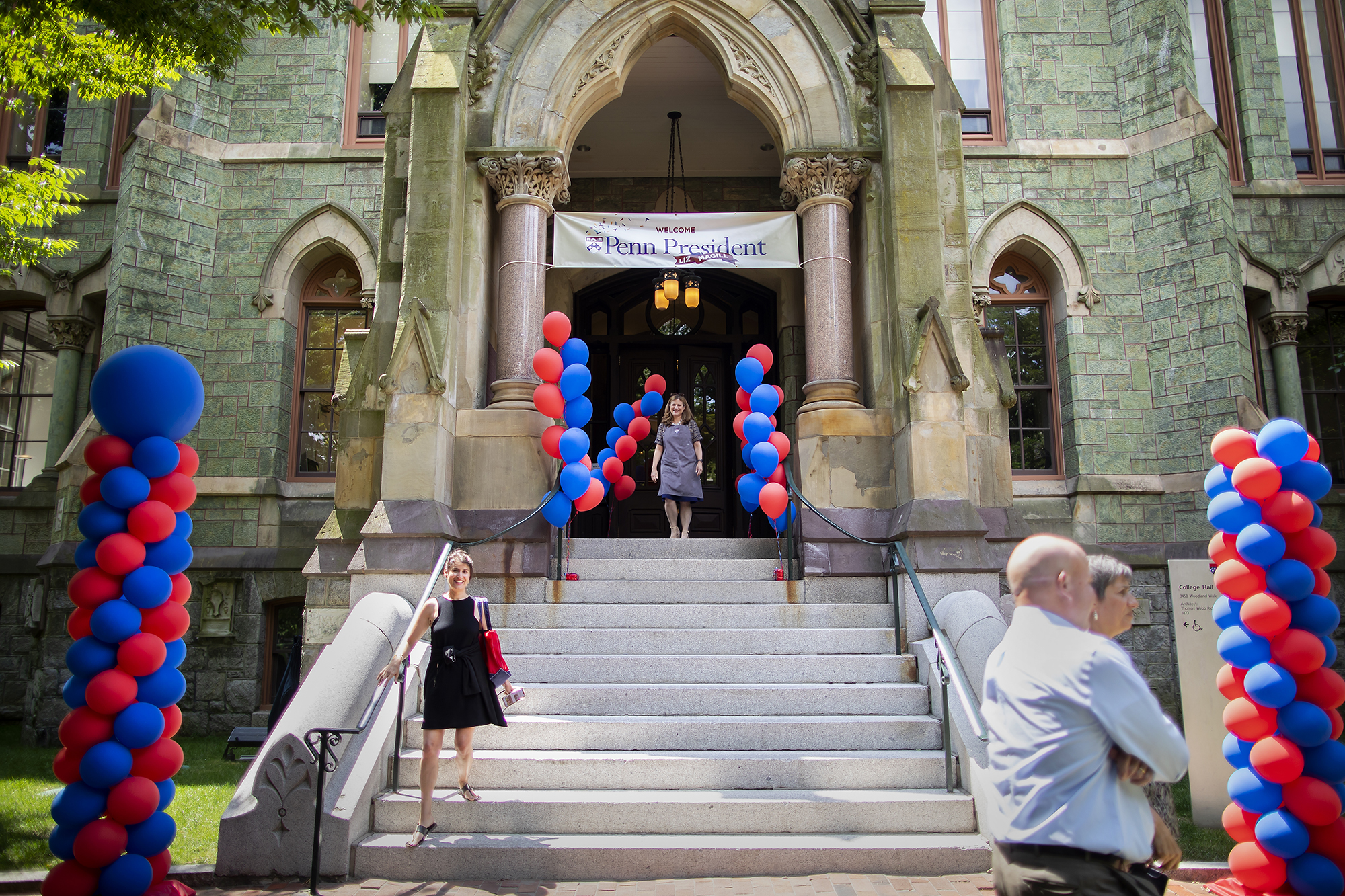 Penn president Liz Magill walks down the steps of College Hall.