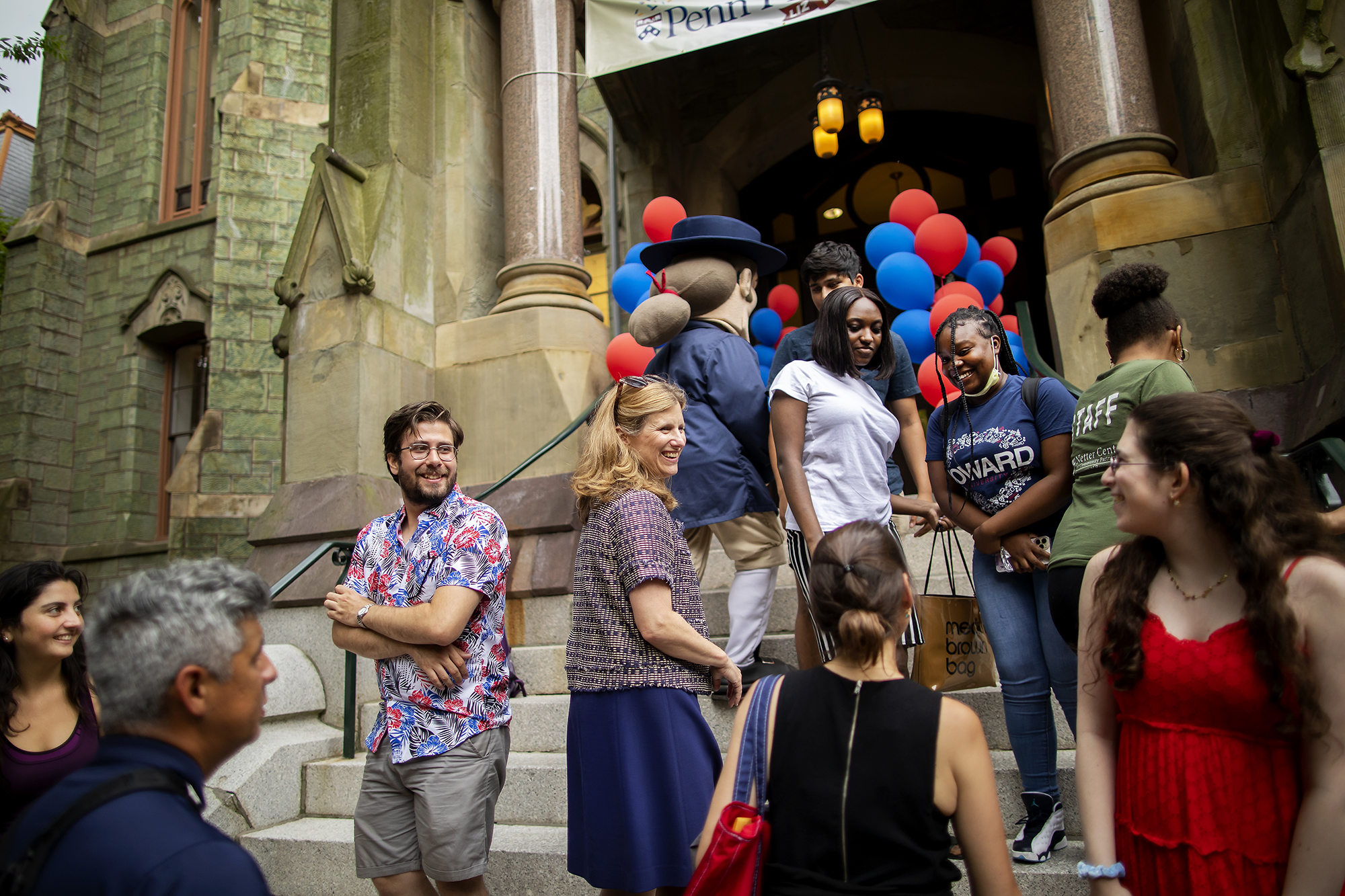 Penn President Liz Magill and a crowd of people on the steps of College Hall.