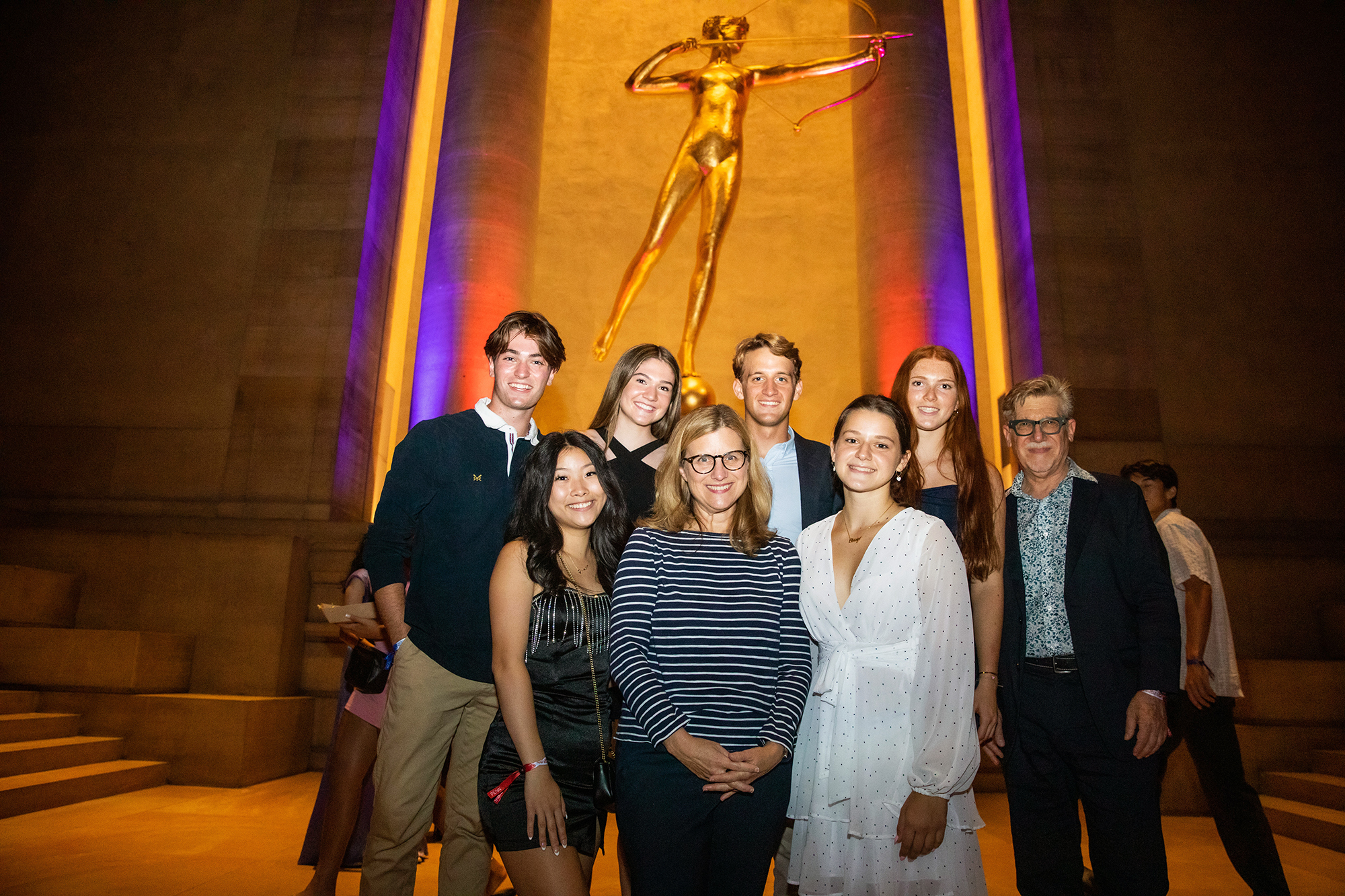 Penn President Liz Magill and several people standing in front of the Diana statue at PMA.