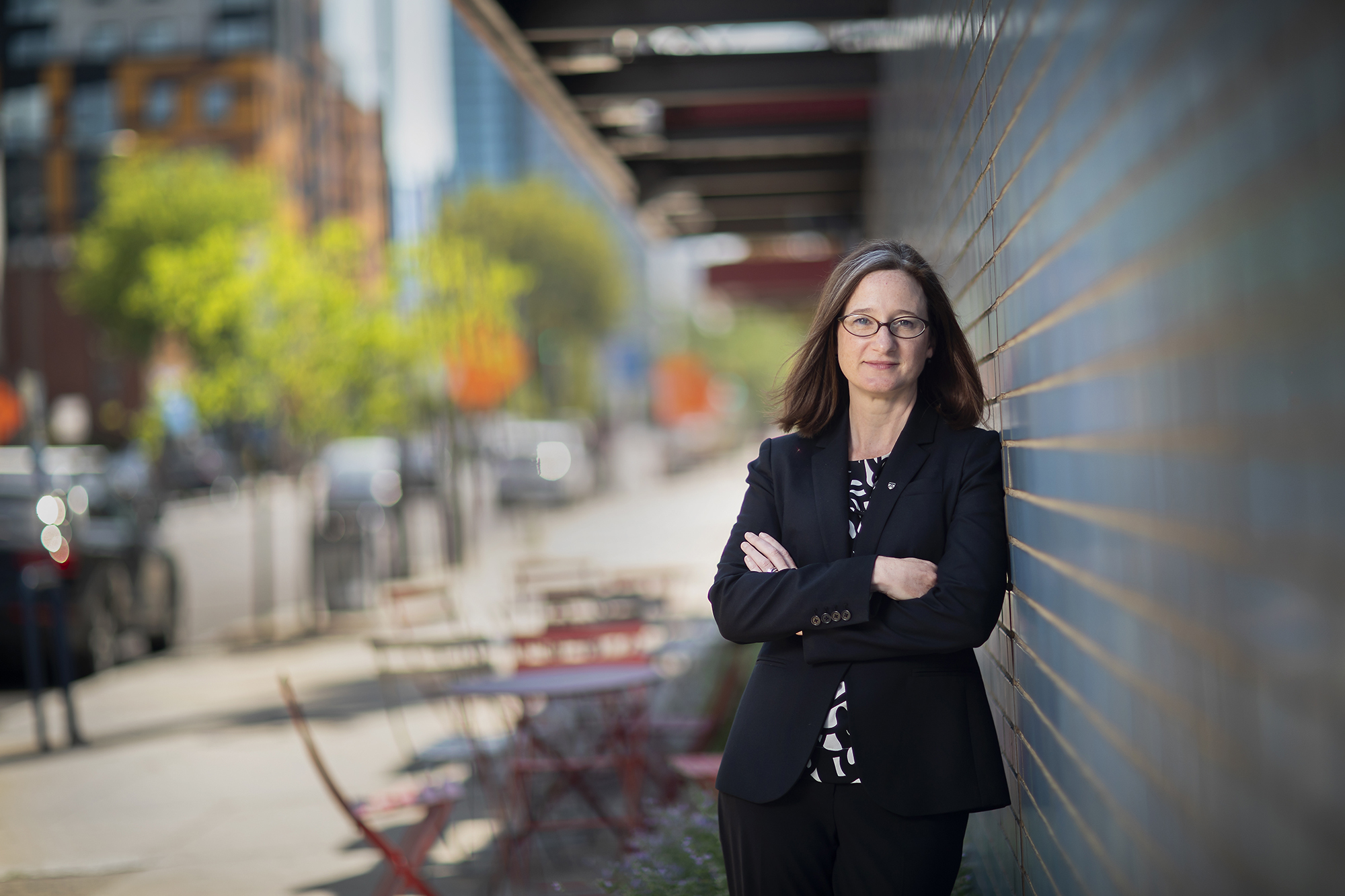 Kathleen Shields Anderson leans against the wall of DPS headquarters