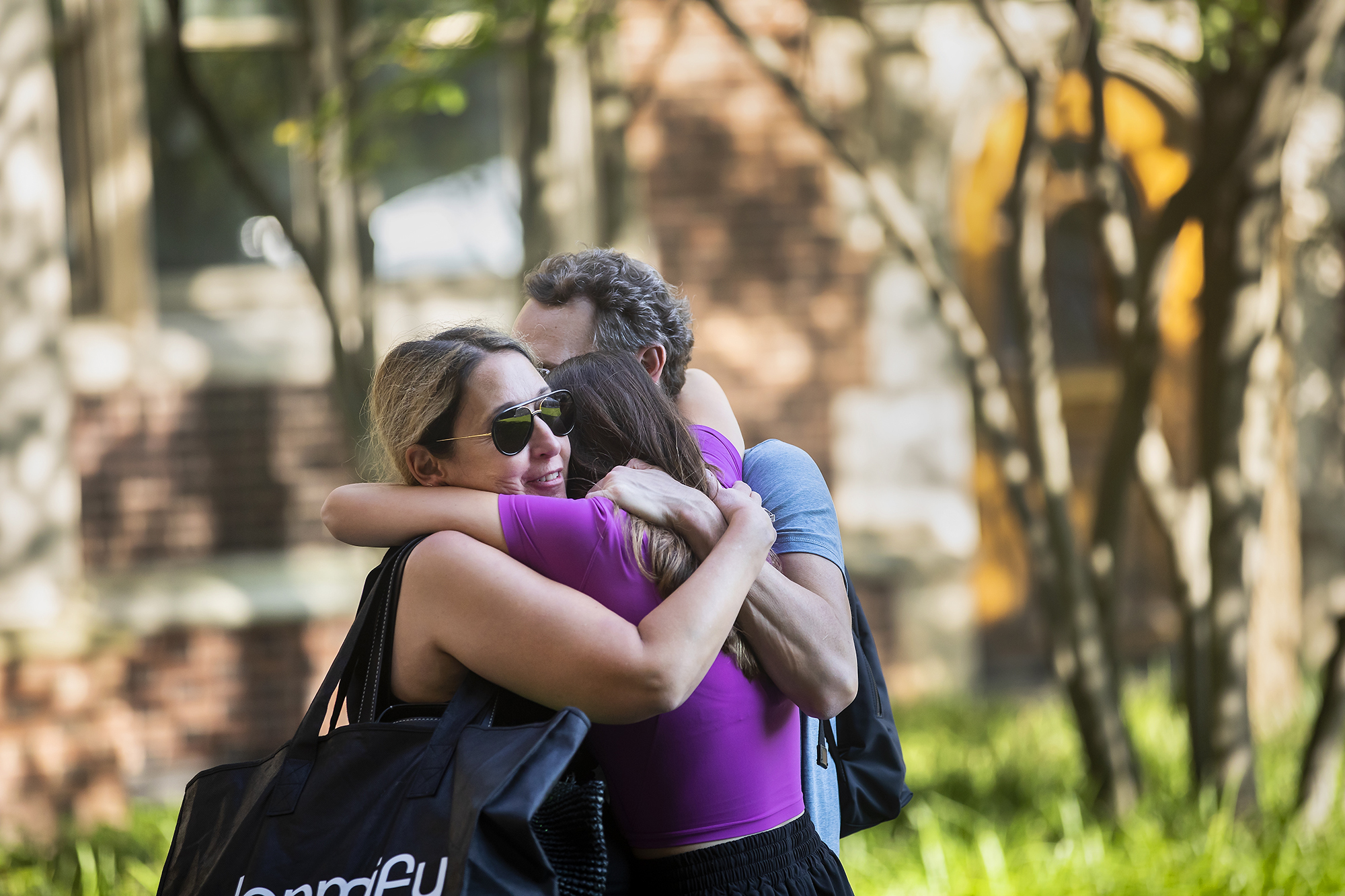 a penn family embraces after move in