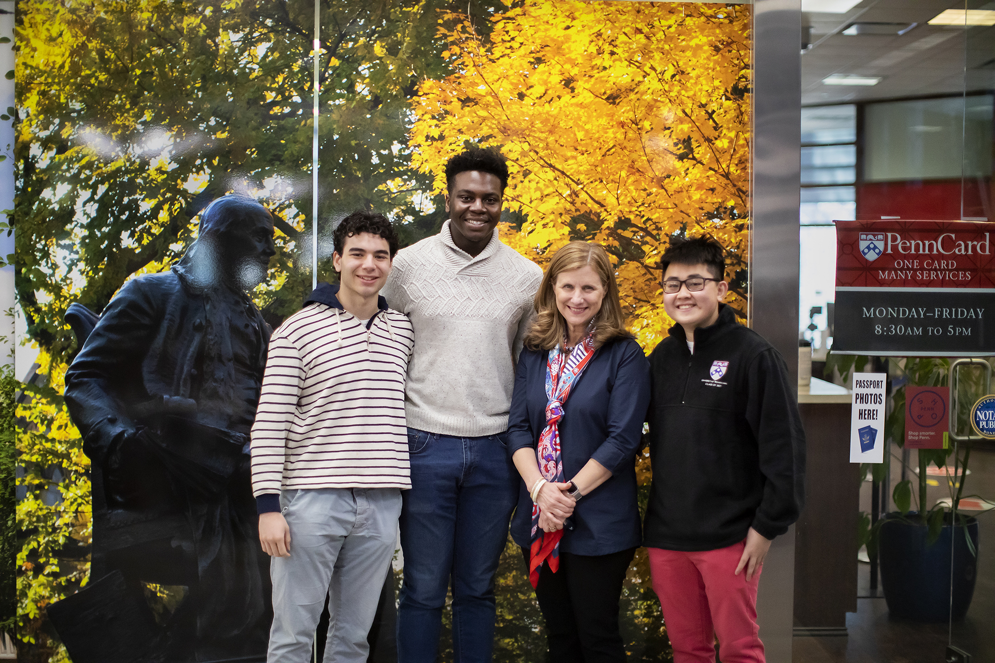 penn president liz magill with students in the penn bookstore