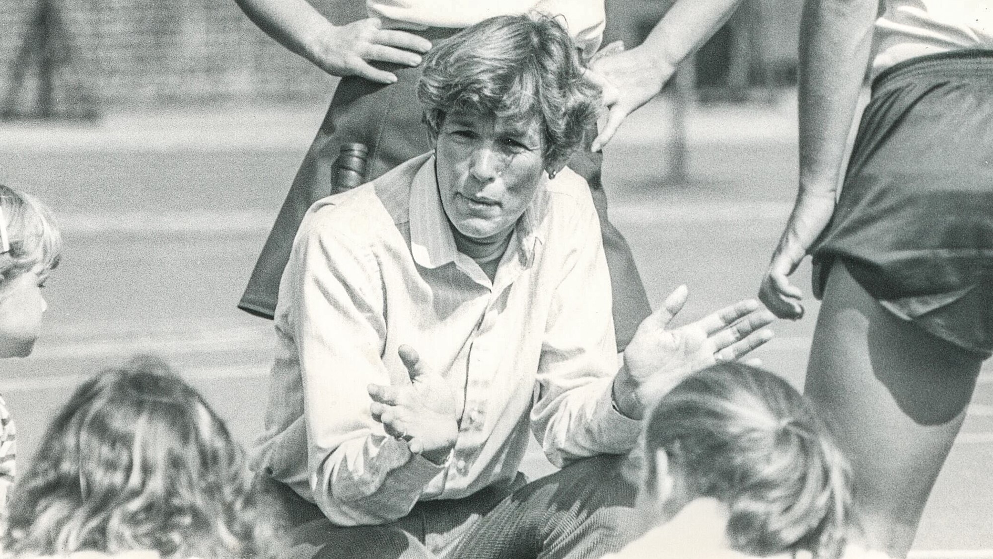 Sage chats with her players during her coaching days at Penn.