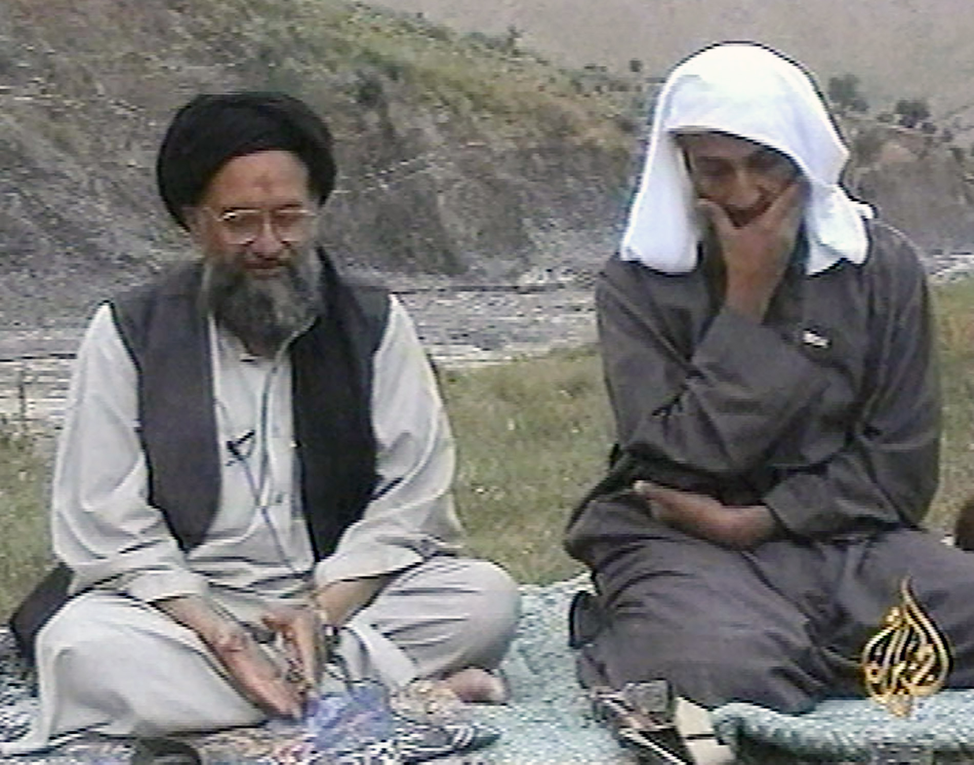 Osama bin Laden, right, listens as his top deputy Ayman al-Zawahri speaks at an undisclosed location in 2002