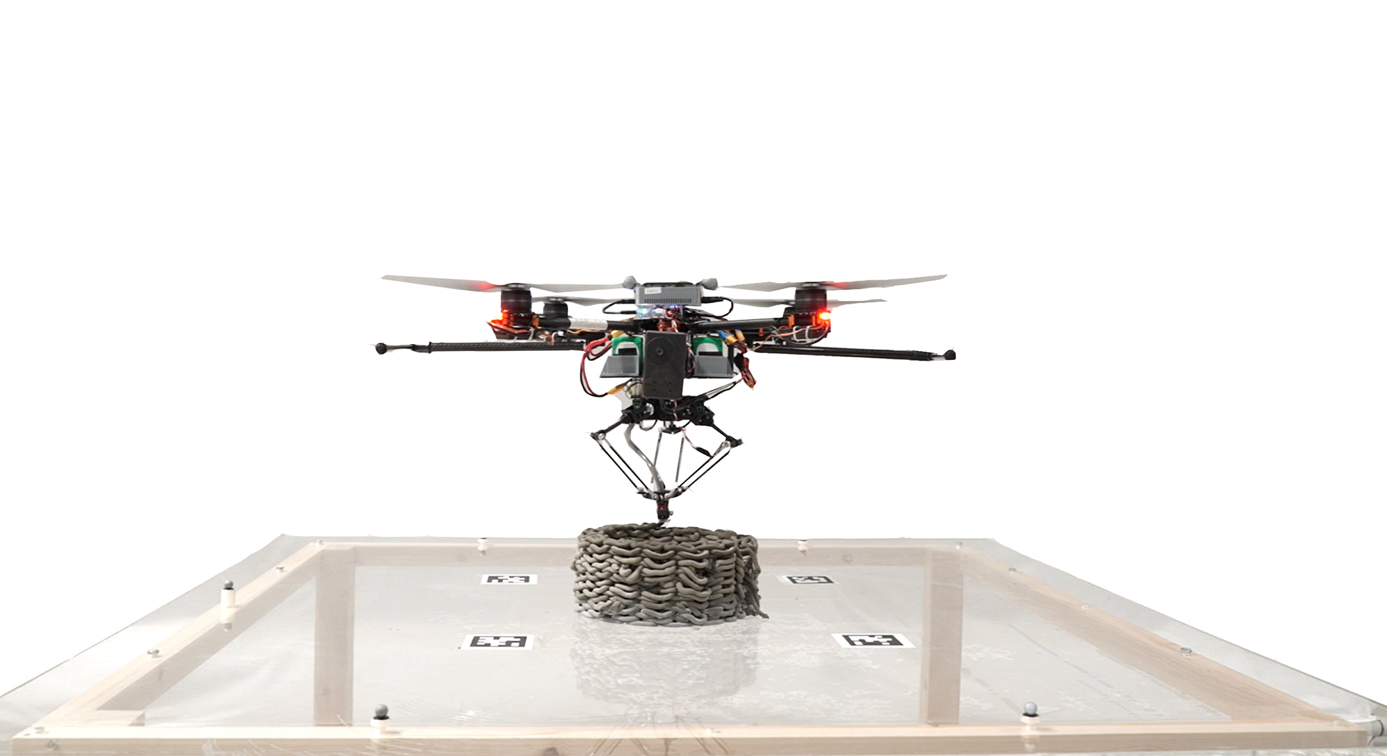 A flying robot doing making a 3-d print.
